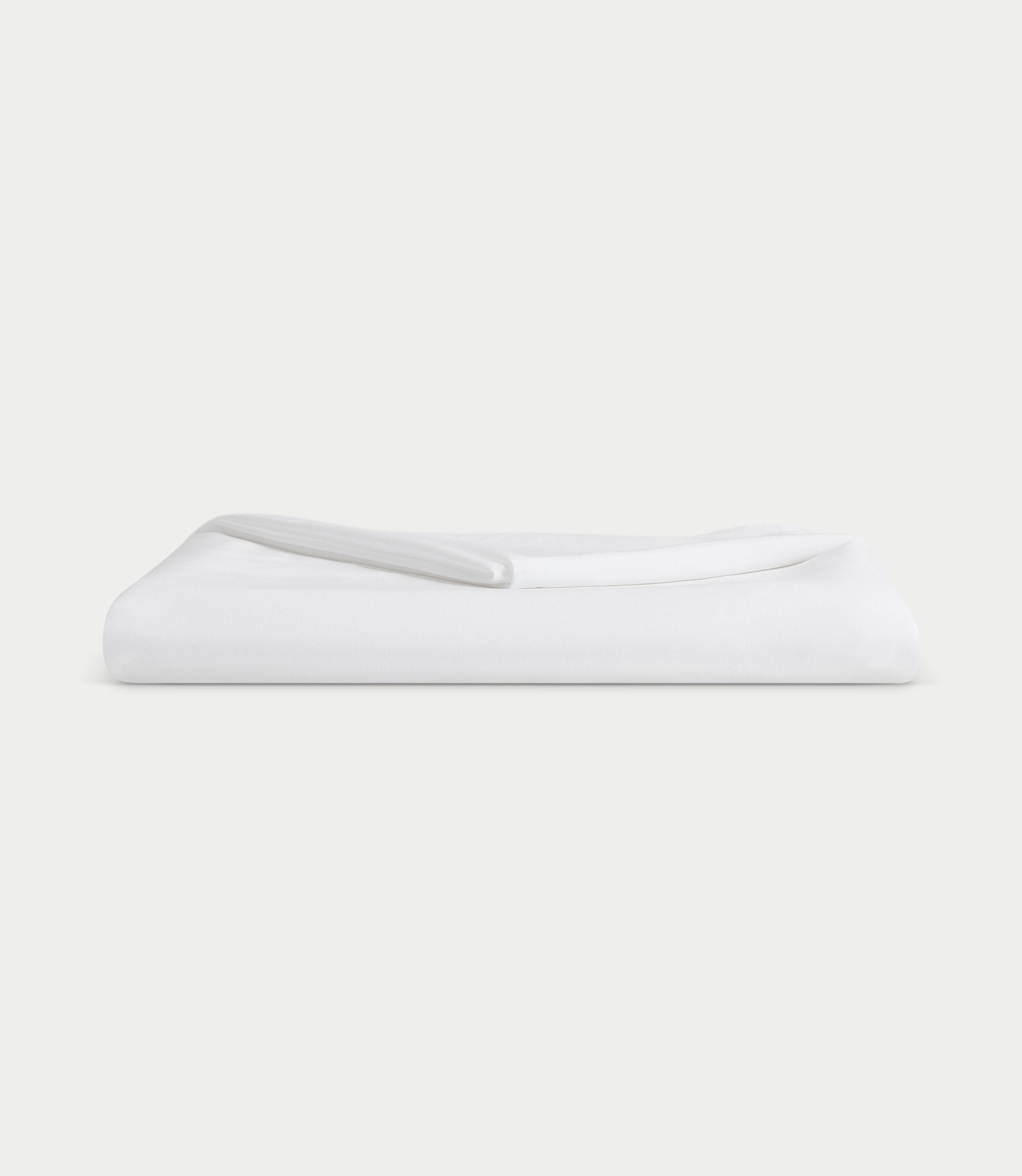 White flat sheet folded with white background 