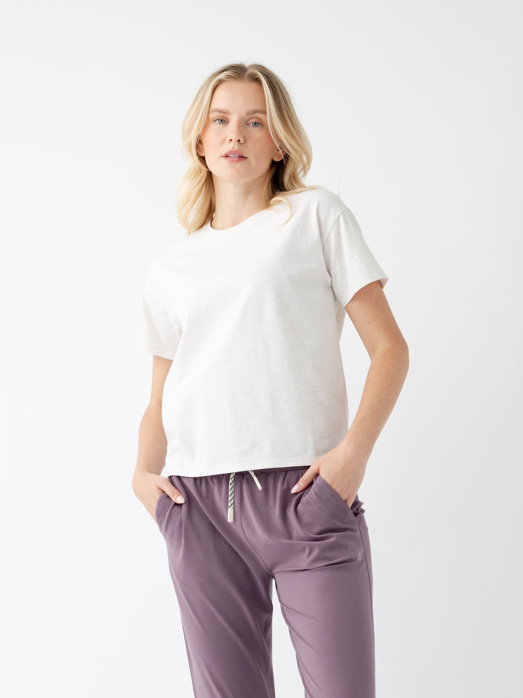 Woman in alabaster tee with white background |Color:Alabaster Heather