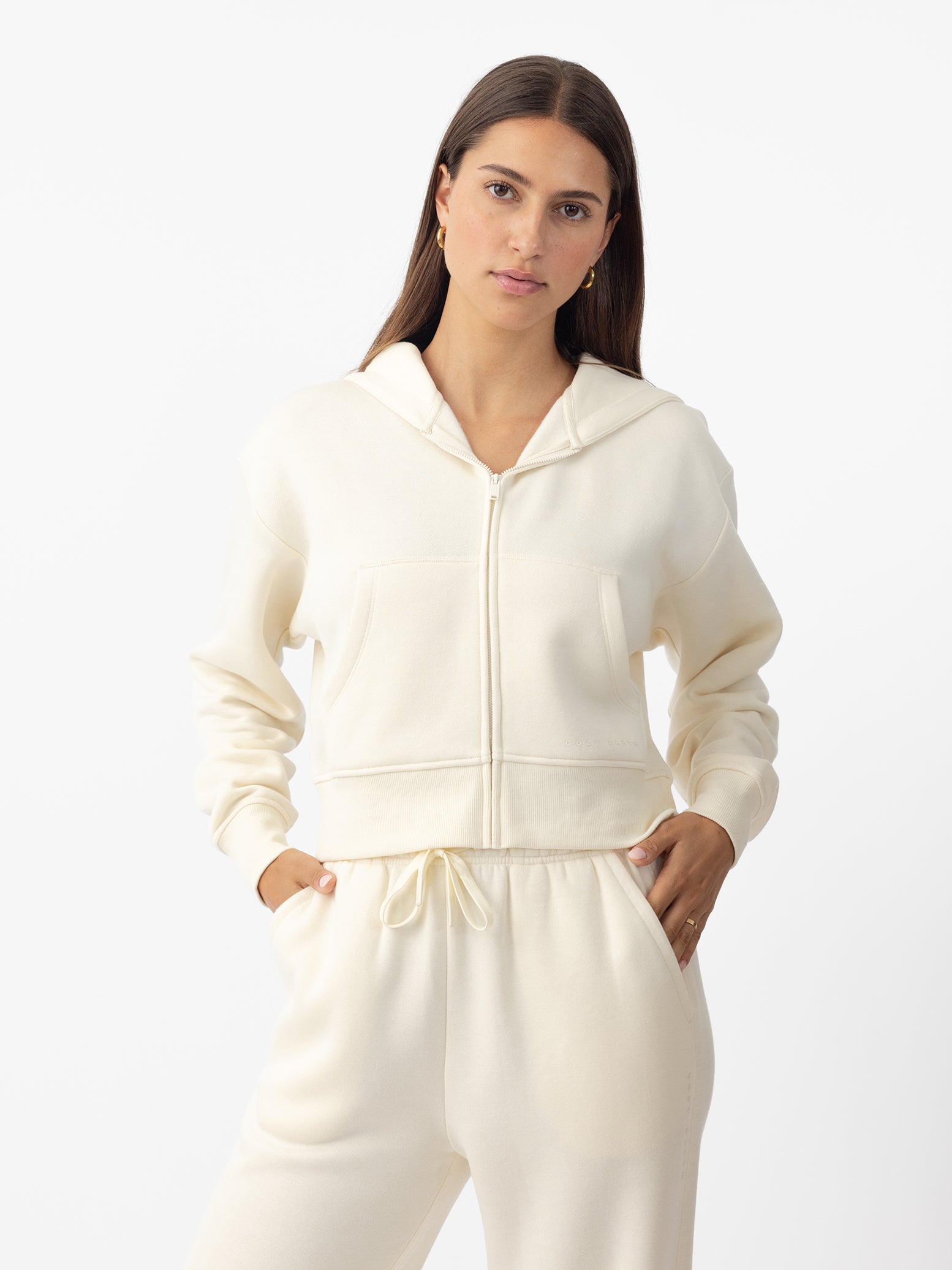 Woman wearing Alabaster CityScape Cropped Full Zip with white background 