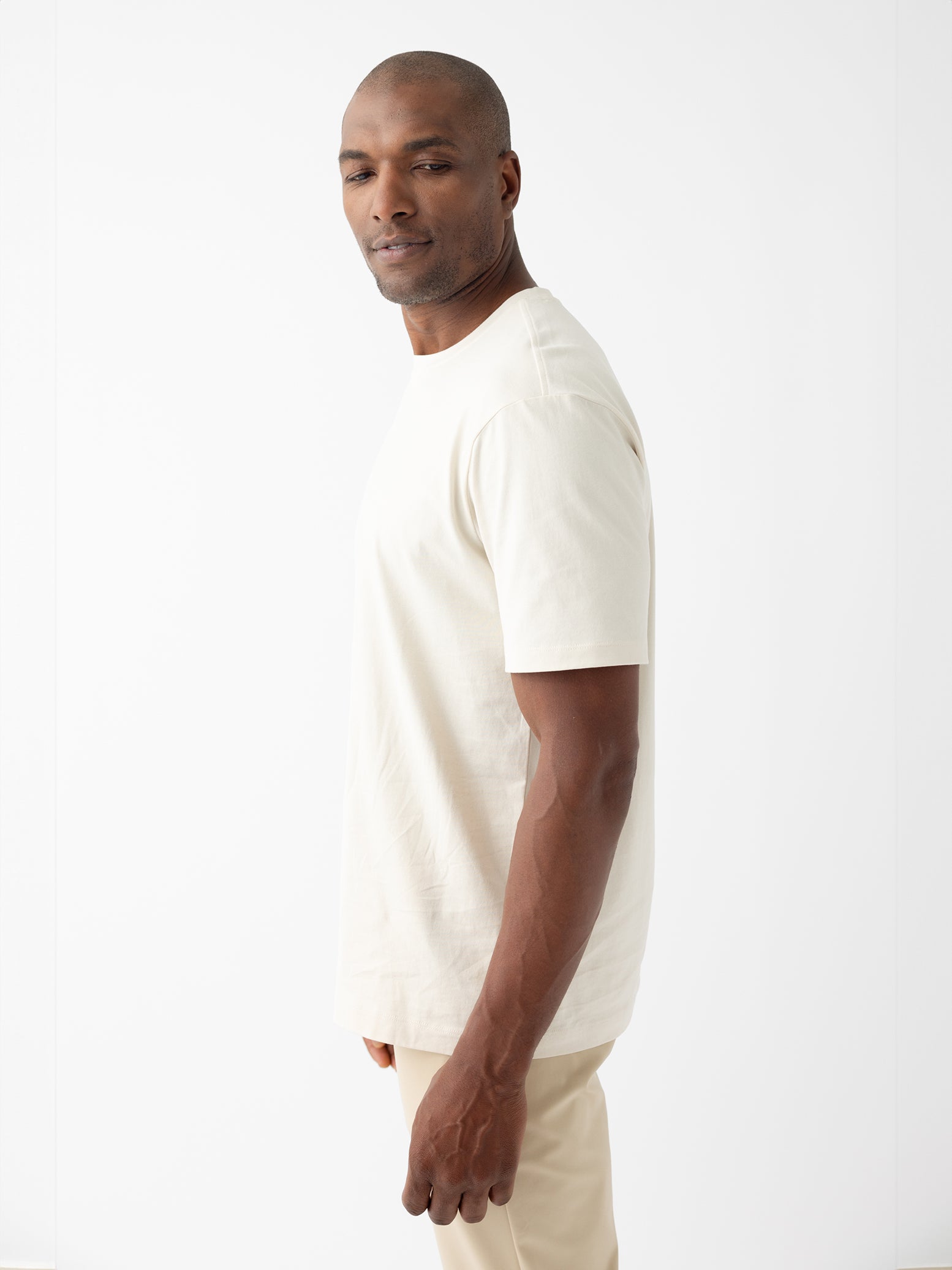 Man wearing alabaster tee with white background |Color:Alabaster