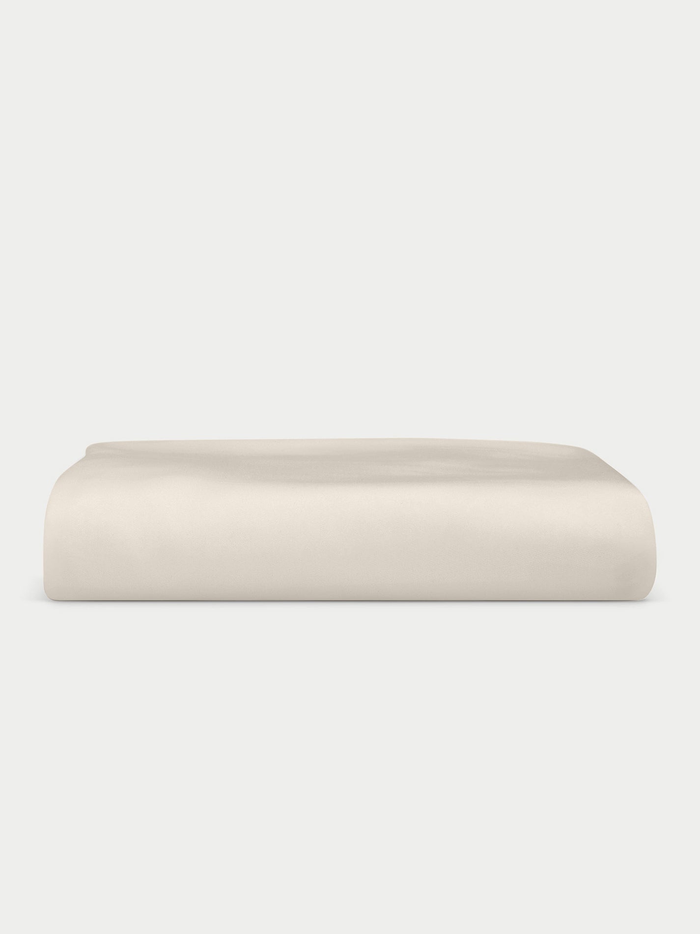 Folded fitted birch sheet with white background 