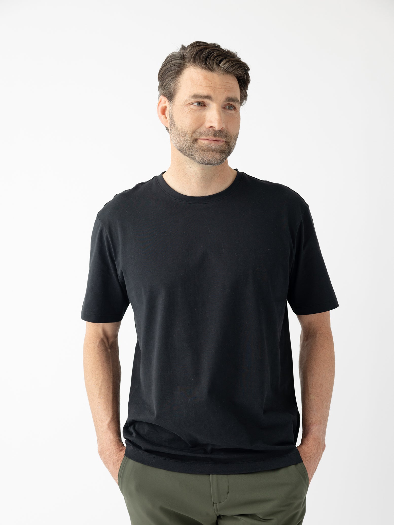 Man wearing black all day tee with white background |Color:Jet Black