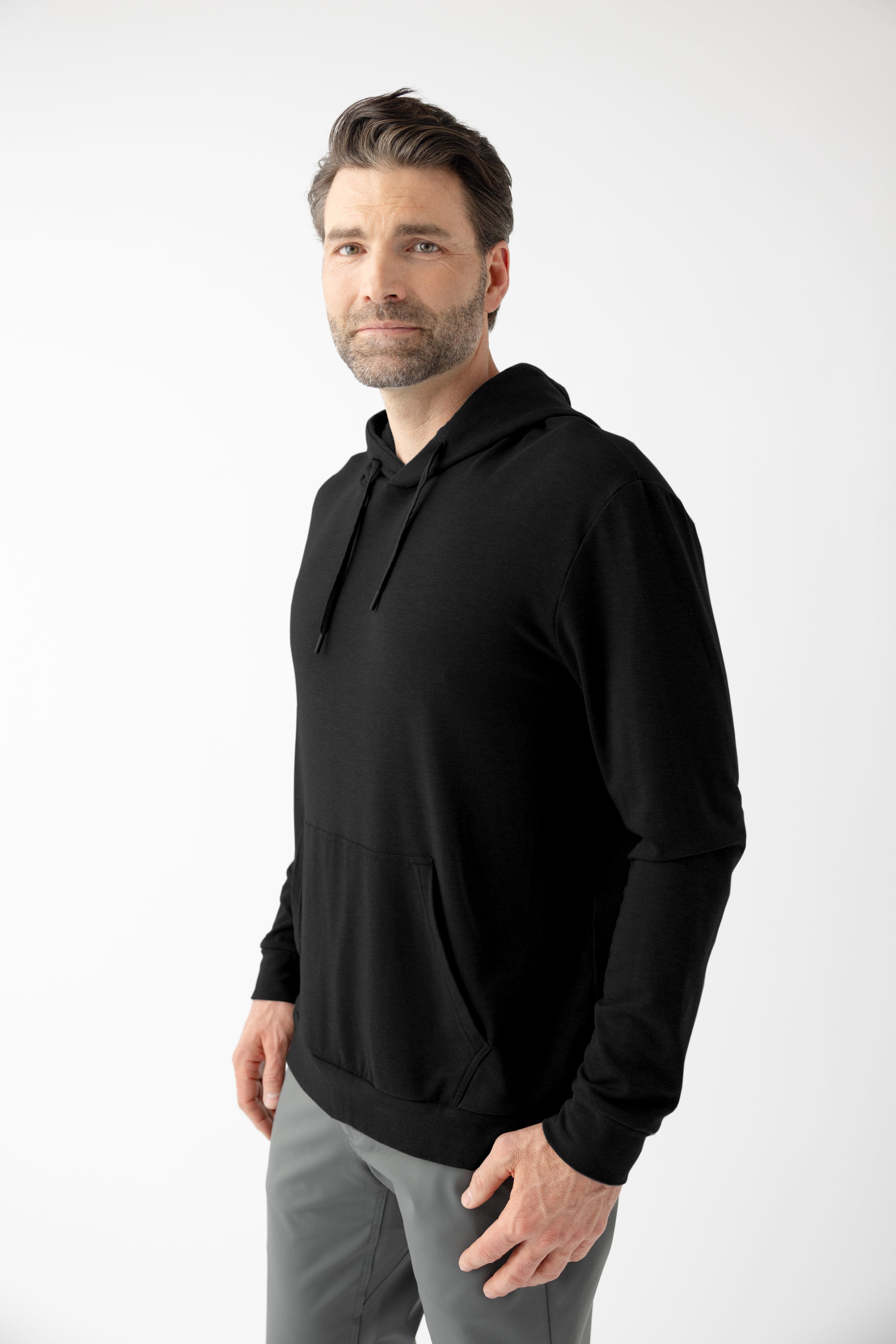 Man wearing black hoodie with white background |Color:Black