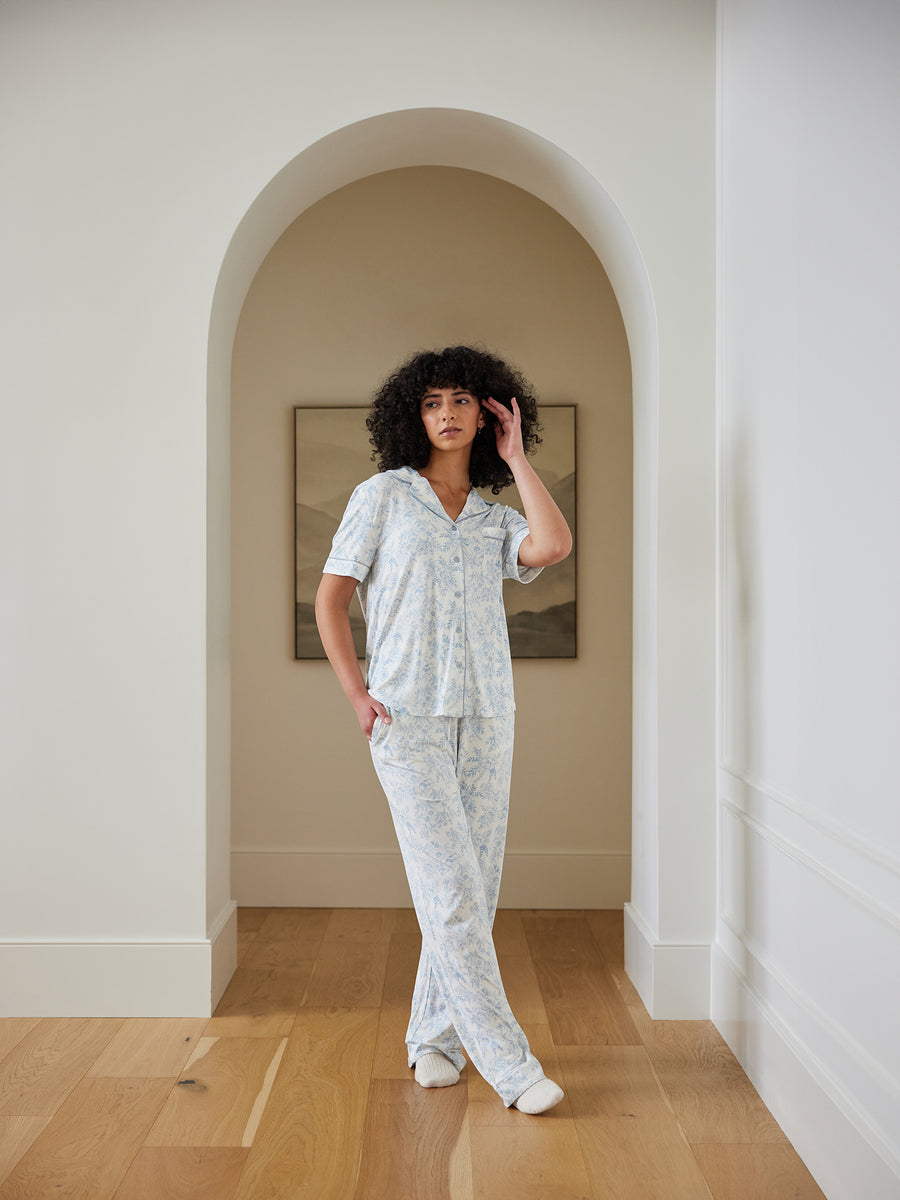 Woman standing in hallway in blue toile pajama set |Color:Blue Toile