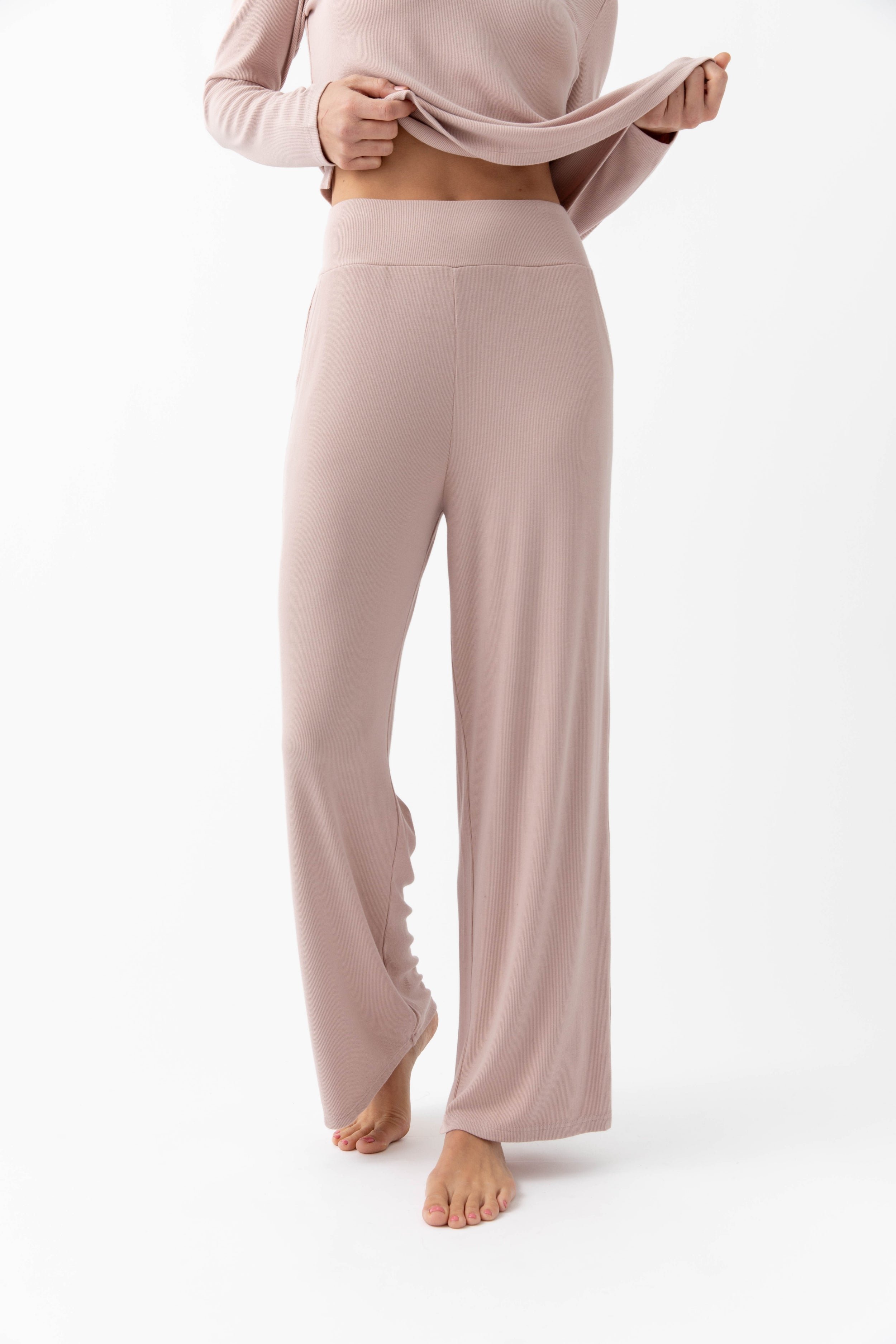 Woman wearing blush rib knit pants
