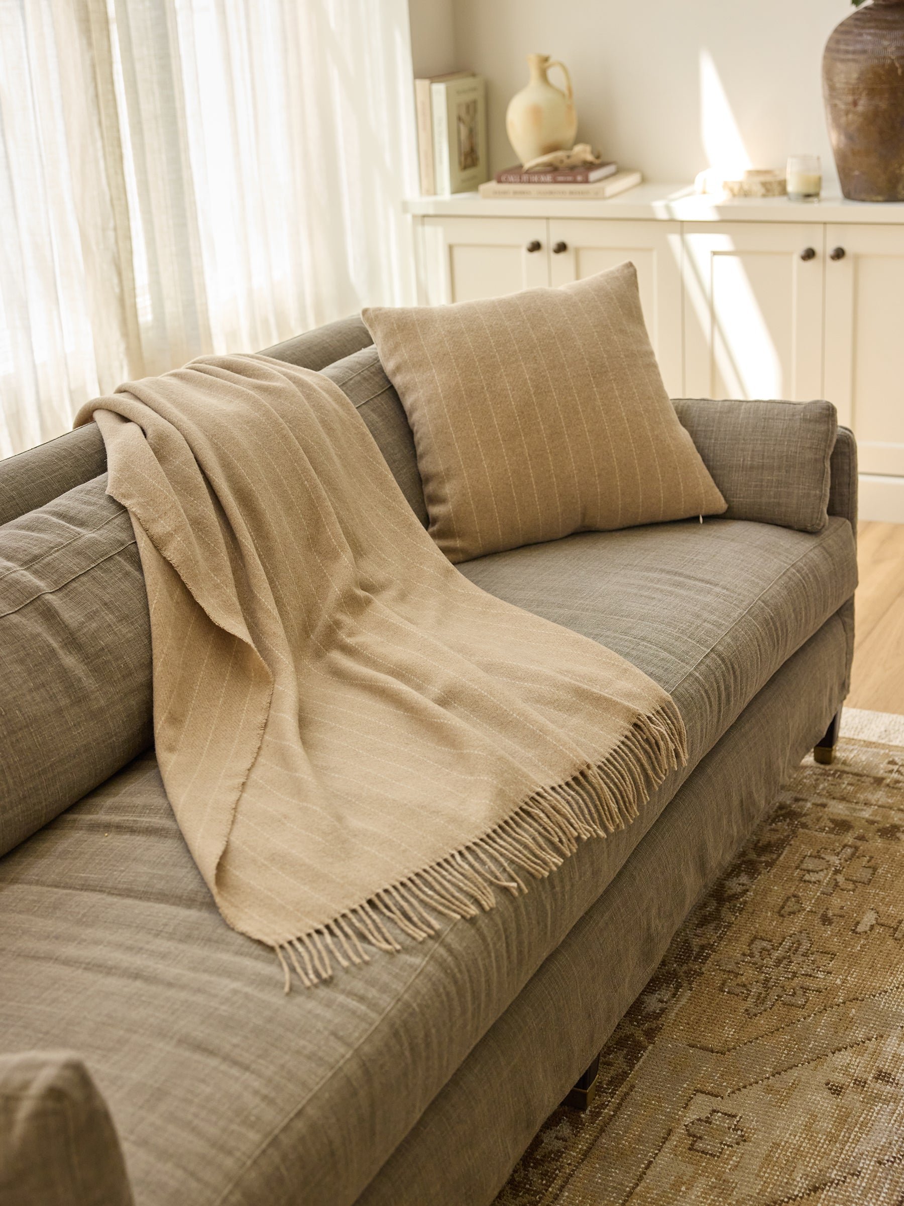 Florence pillow and blanket rested on sofa |Color:Brandy
