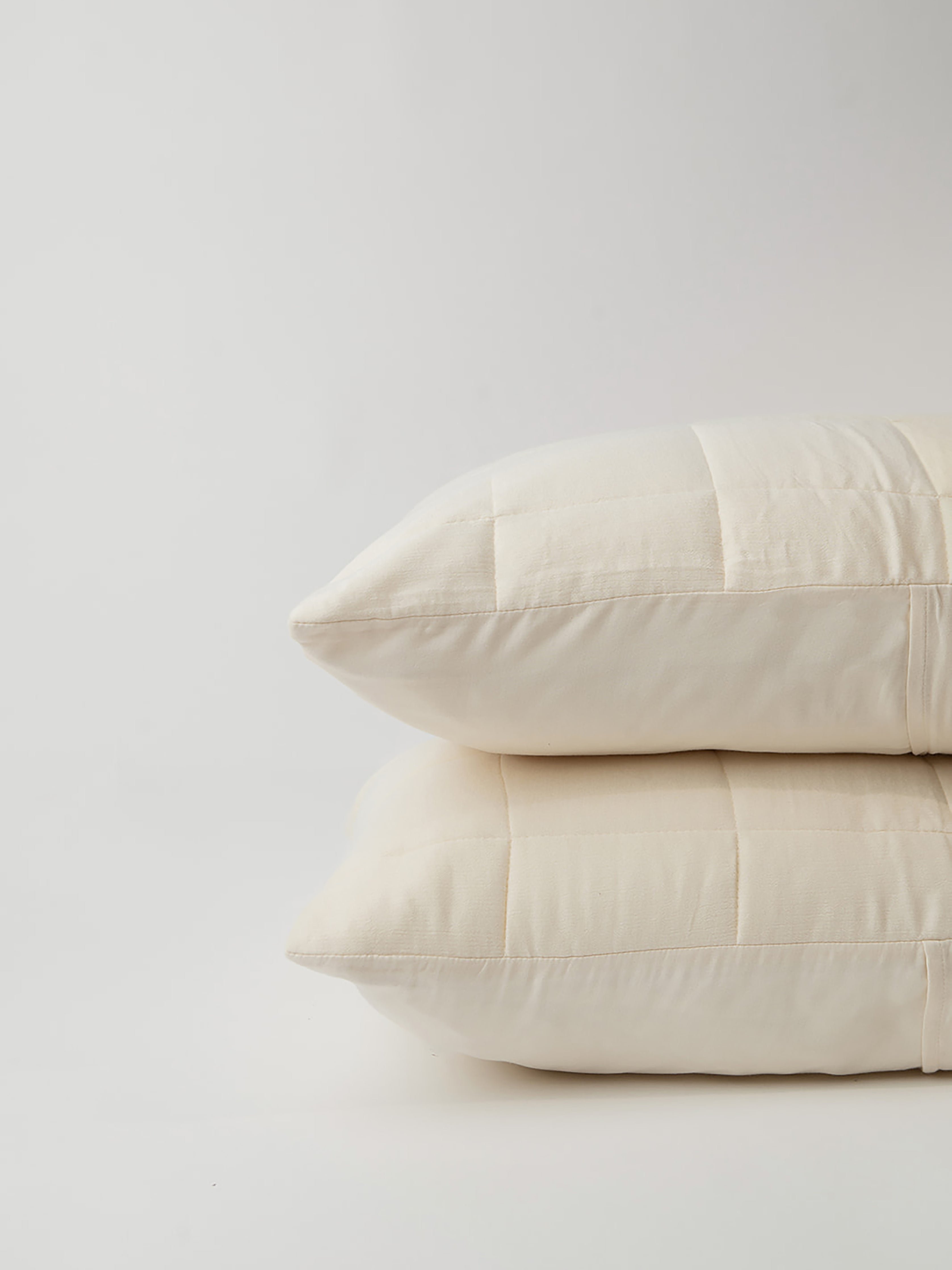 Buttermilk Aire Bamboo Box Quilt Euro Sham king size. The sham is resting on a white background