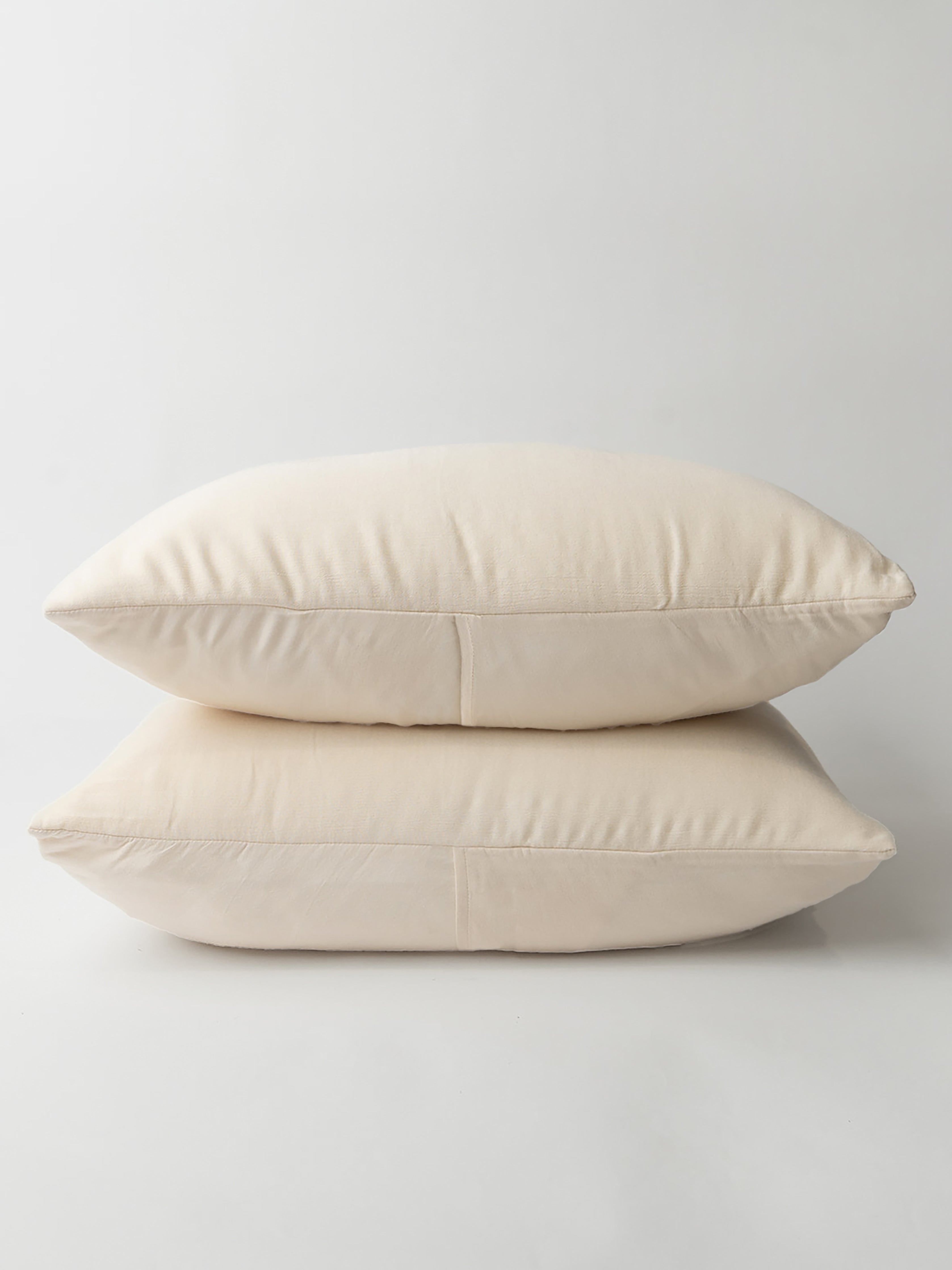 Buttermilk Aire Bamboo Shams. The shams are photographed with a white background|Color:Buttermilk|Style:Standard