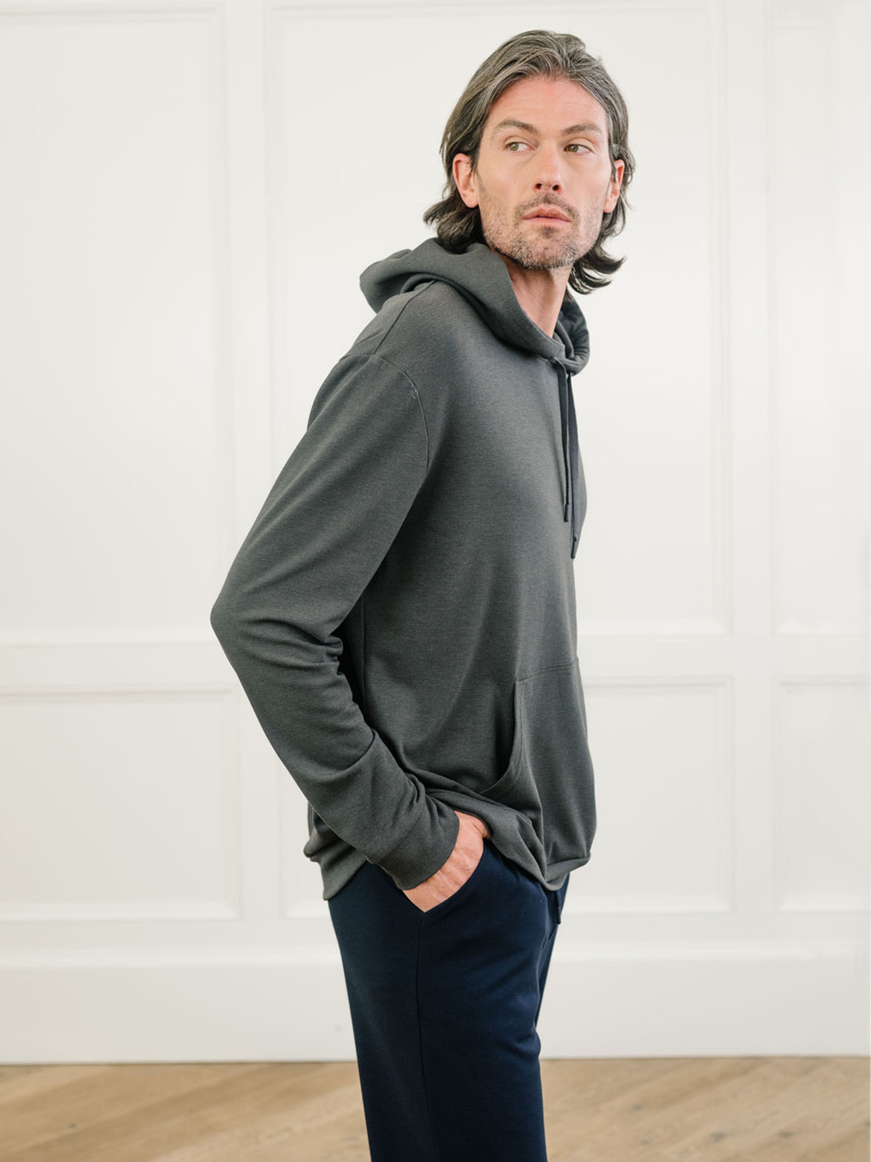 Charcoal Bamboo Hoodie worn by man standing in front of white background.|Color:Charcoal