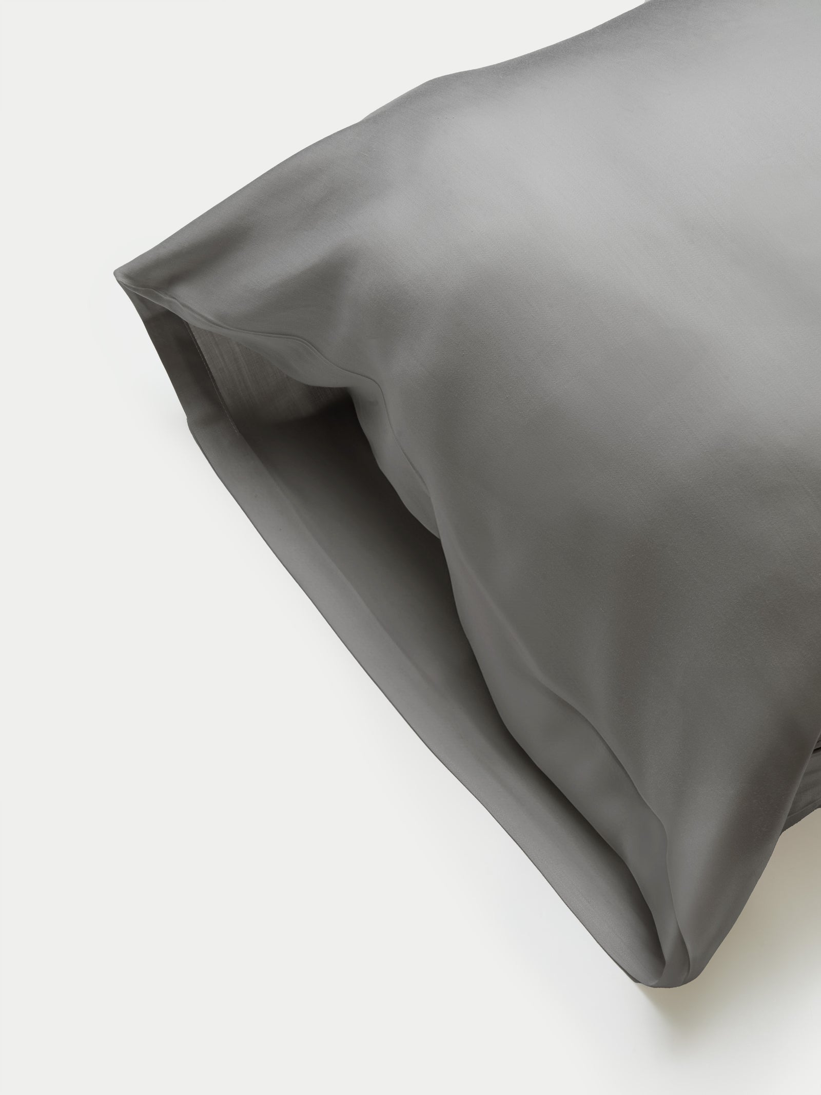 Side of charcoal body pillowcase with plain background