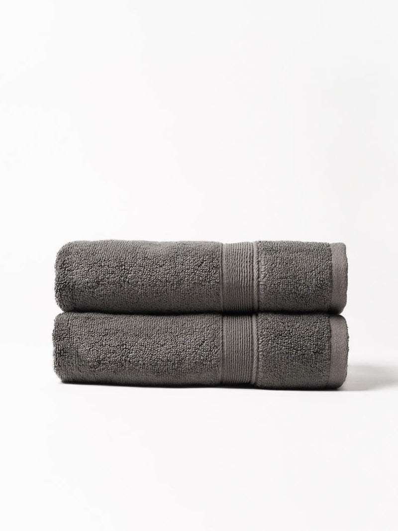 Charcoal luxe bath towels folded with white background