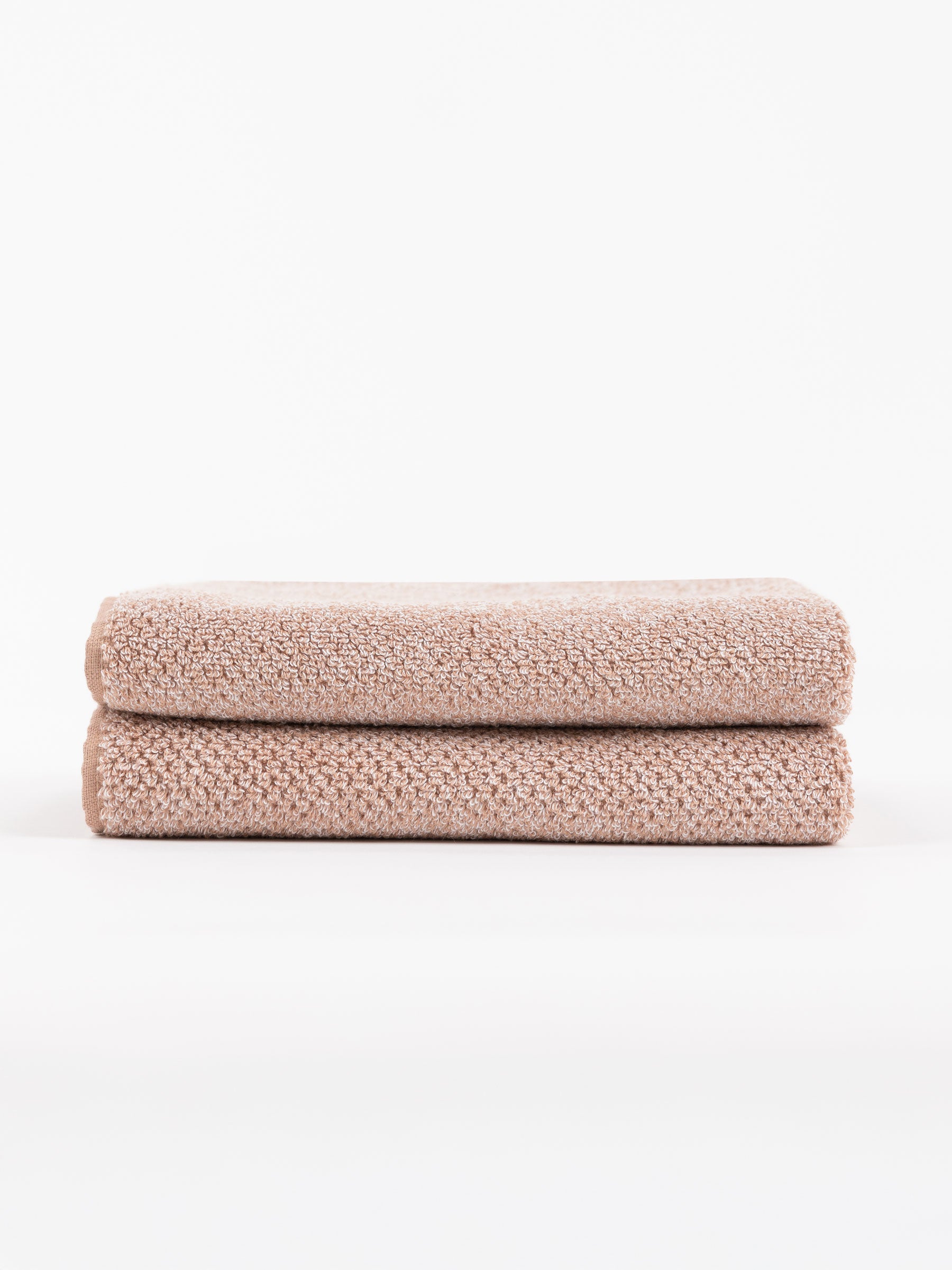 A pair of Nantucket Bath Towels in Heathered Clay are stacked. |Color:Heathered Clay