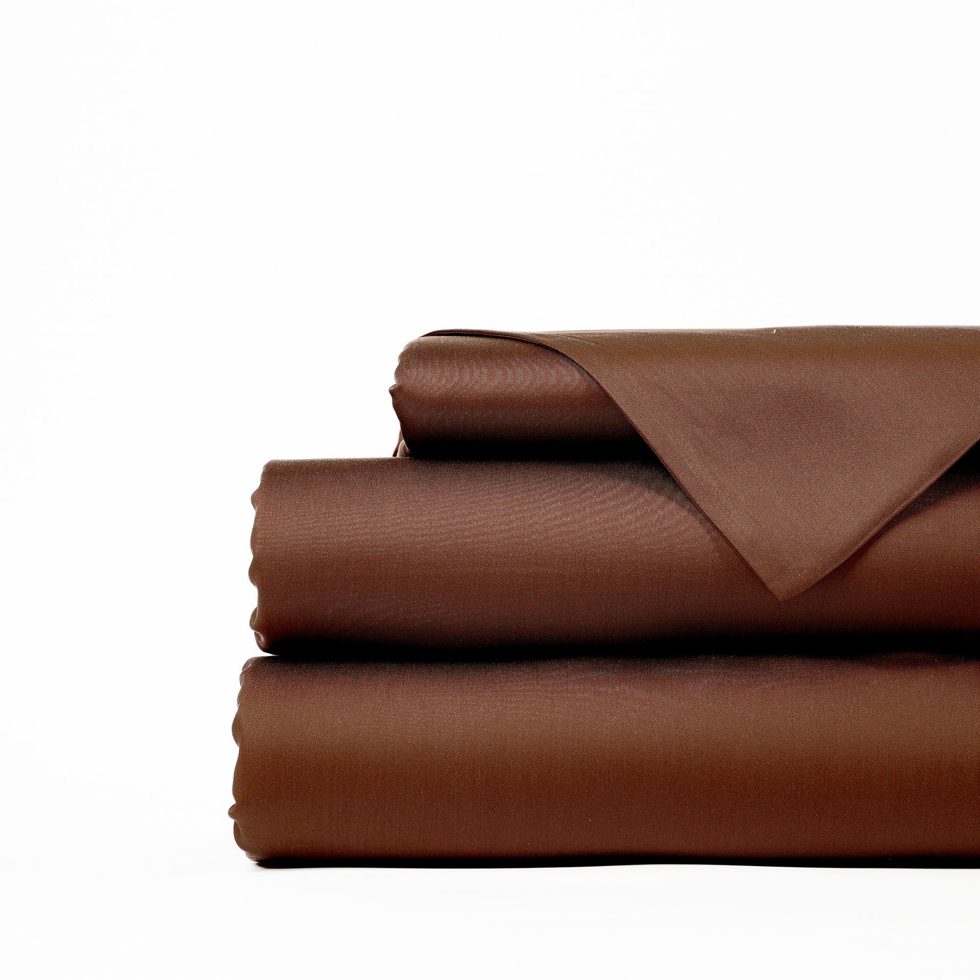 A neatly folded, brown-colored Bamboo Sheet Set by Cozy Earth on a white background. The set includes a flat sheet, fitted sheet, and pillowcases. The fabric appears smooth and has a slight sheen. 