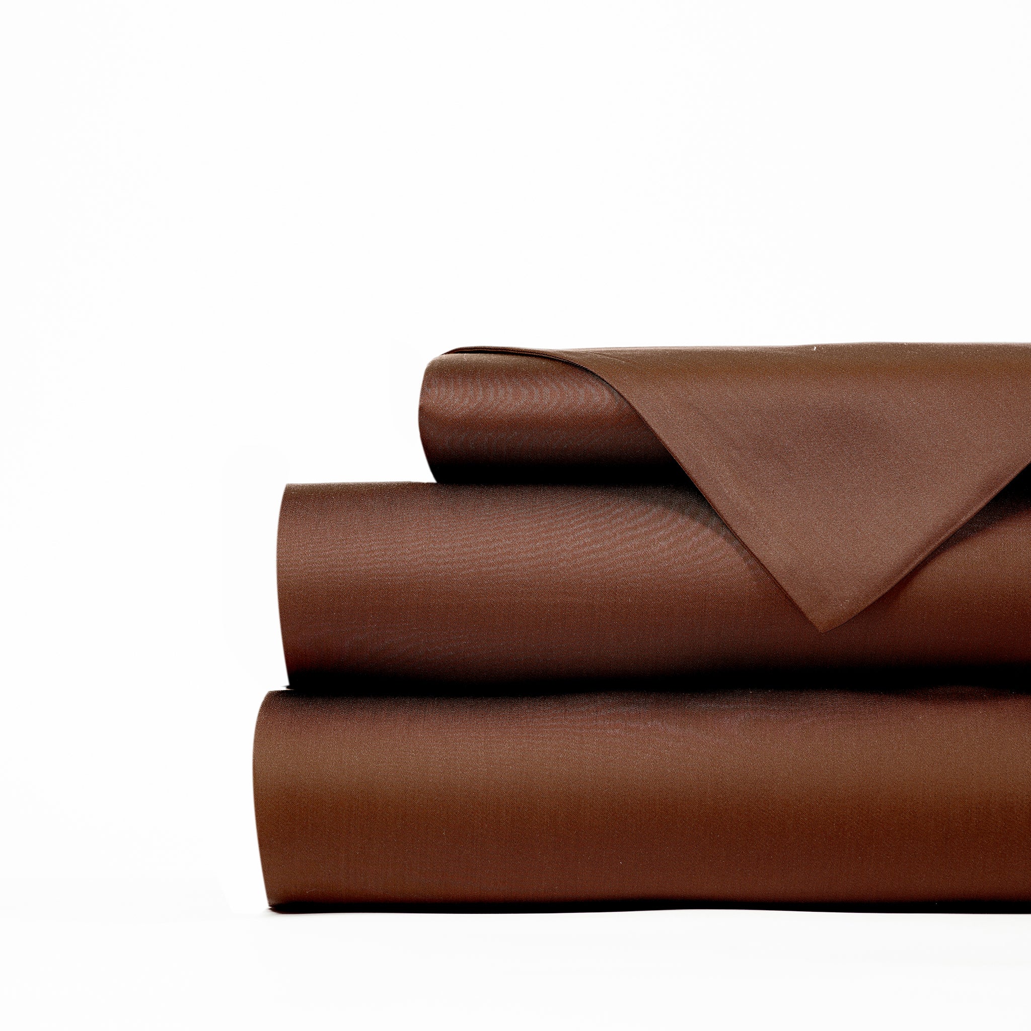 A neatly folded, brown-colored Bamboo Sheet Set by Cozy Earth on a white background. The set includes a flat sheet, fitted sheet, and pillowcases. The fabric appears smooth and has a slight sheen. |Color:Coffee