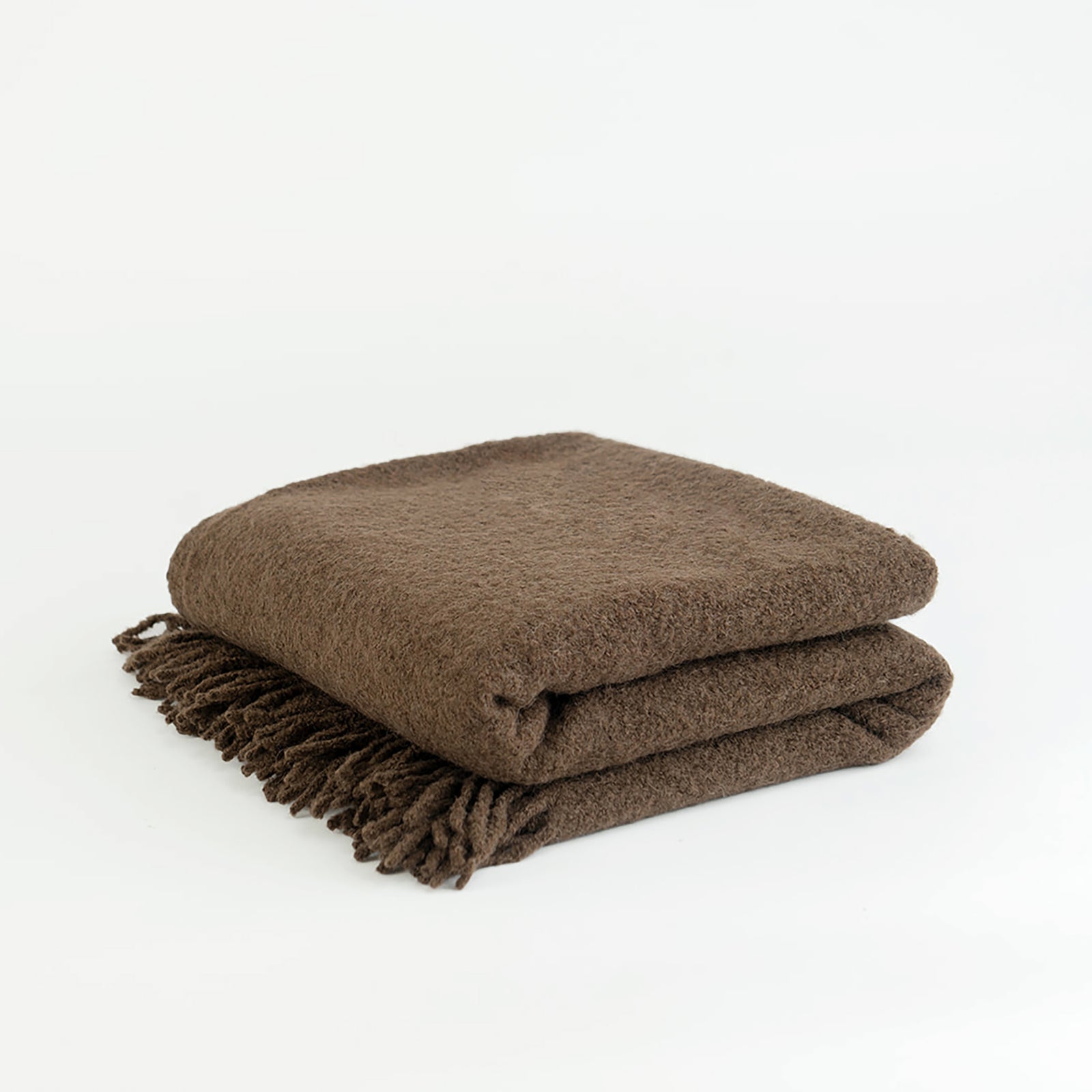Coffee boucle throw folded with white background 