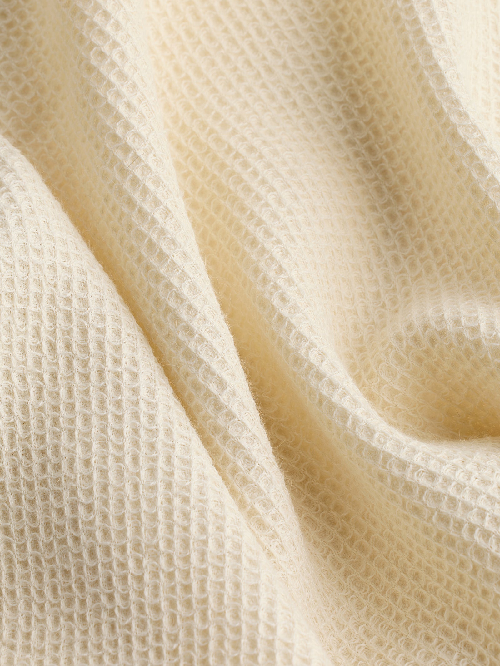 Close up of creme alpaca throw 