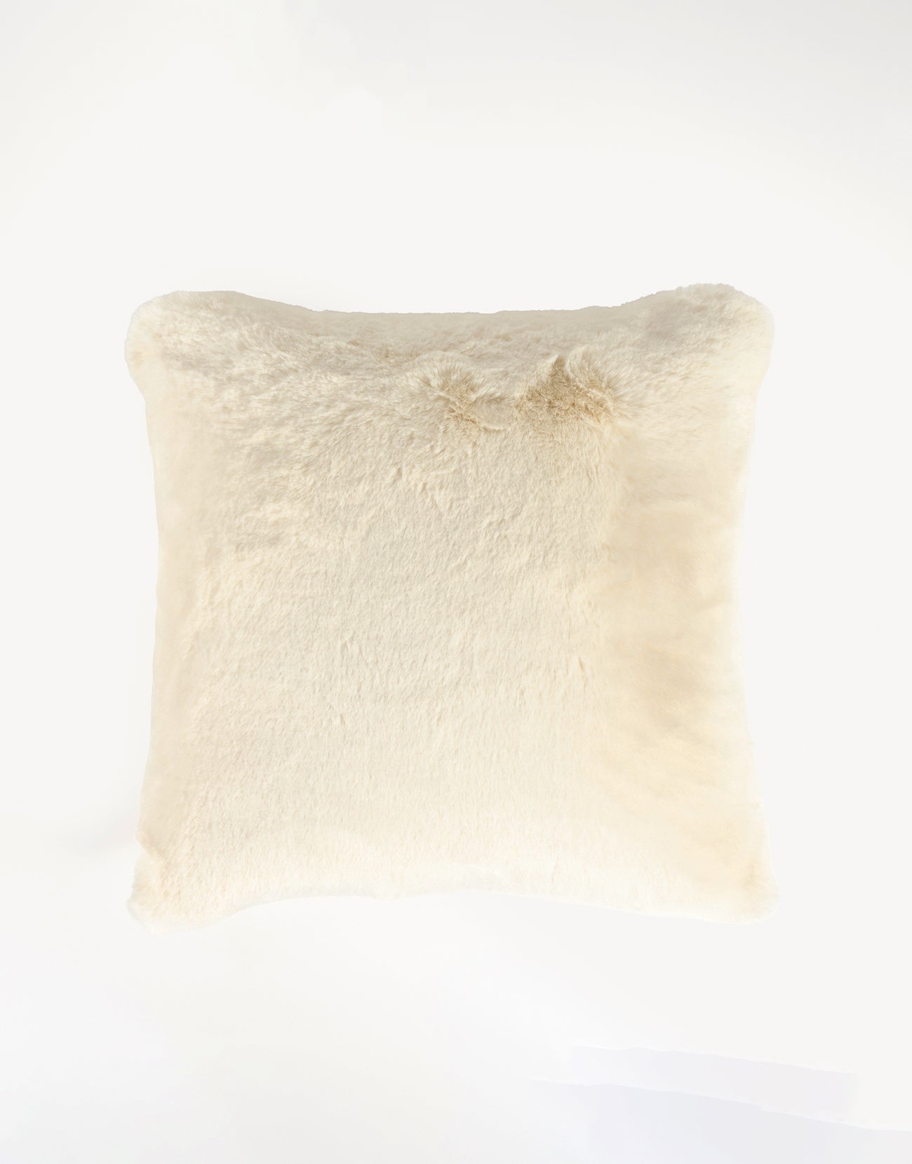 A Cuddle Pillow by Cozy Earth, featuring a square design in light cream, is centered against a plain white background. Its fluffy and plush texture promises a cozy and comfortable feel. |Color:Creme