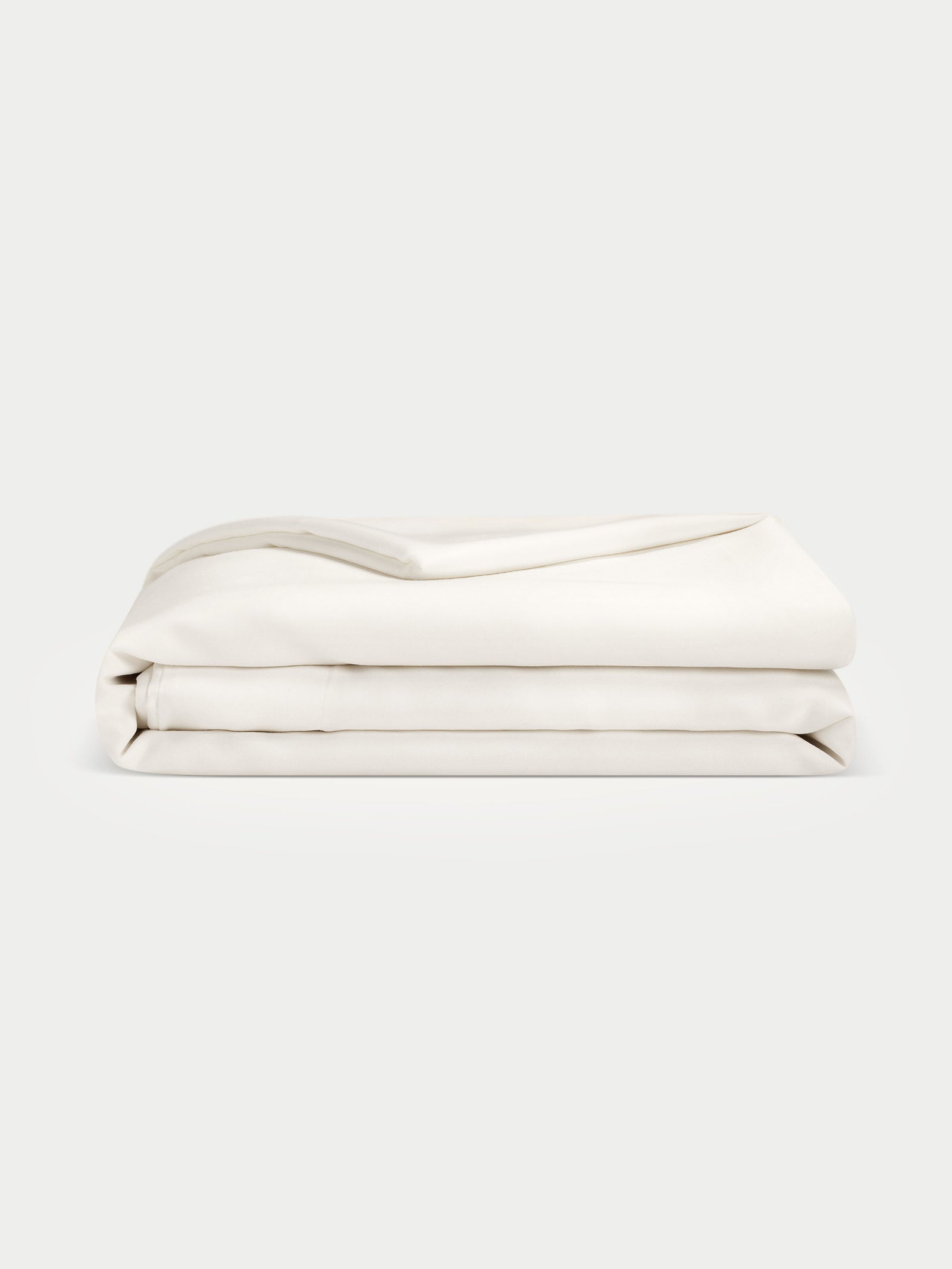 Creme duvet cover folded with white background 
