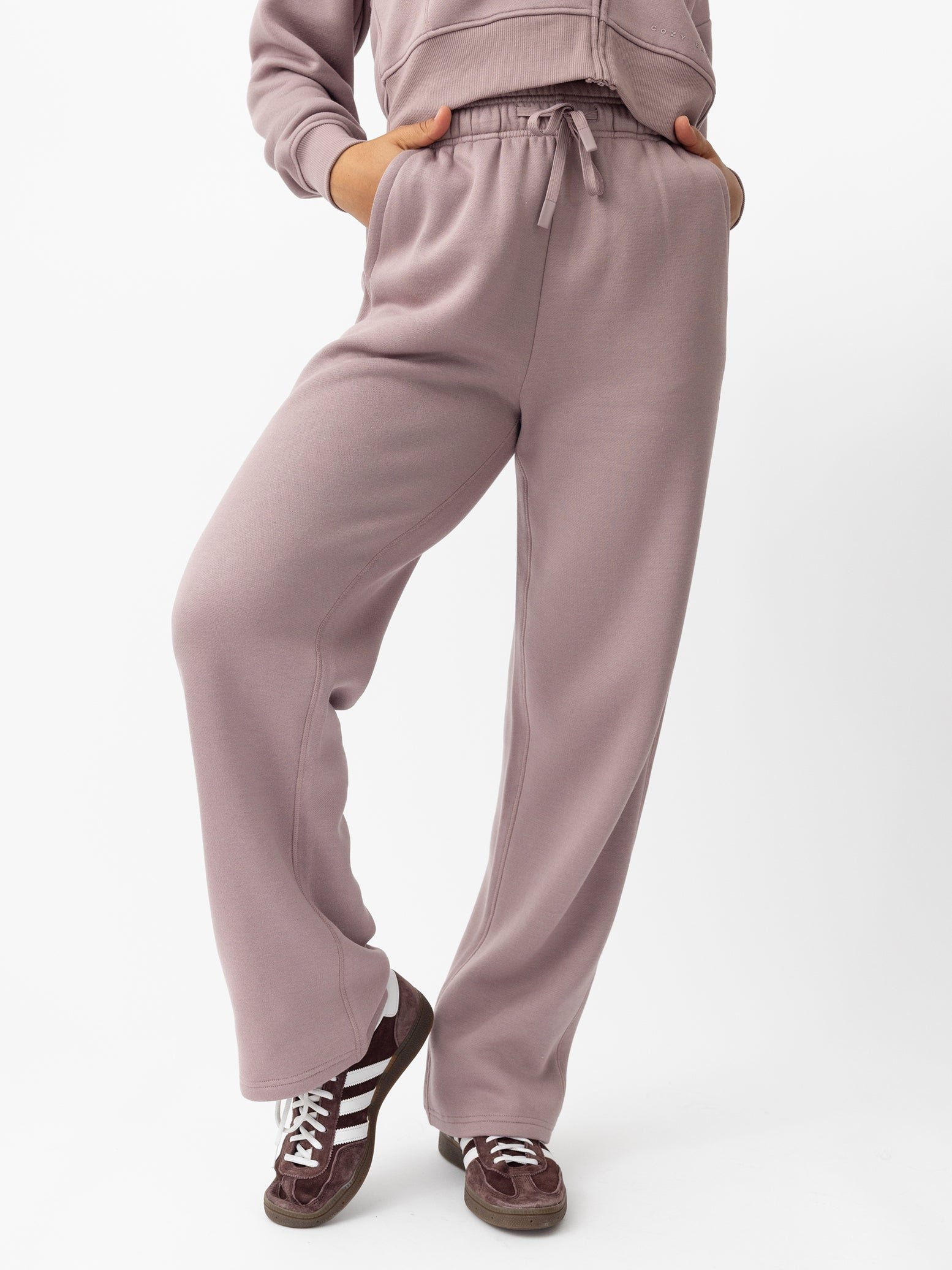 Woman wearing Dusty Orchid CityScape Wide Leg Pant with white background 