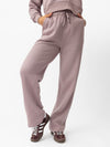 Woman wearing Dusty Orchid CityScape Wide Leg Pant with white background |Color: Dusty Orchid