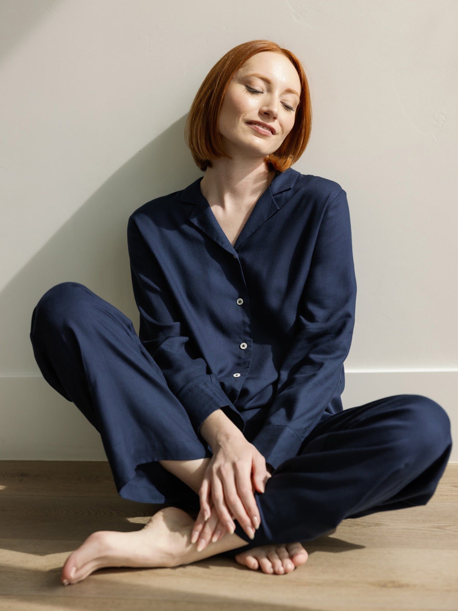 Woman in home wearing Eclipse soft woven pajamas 