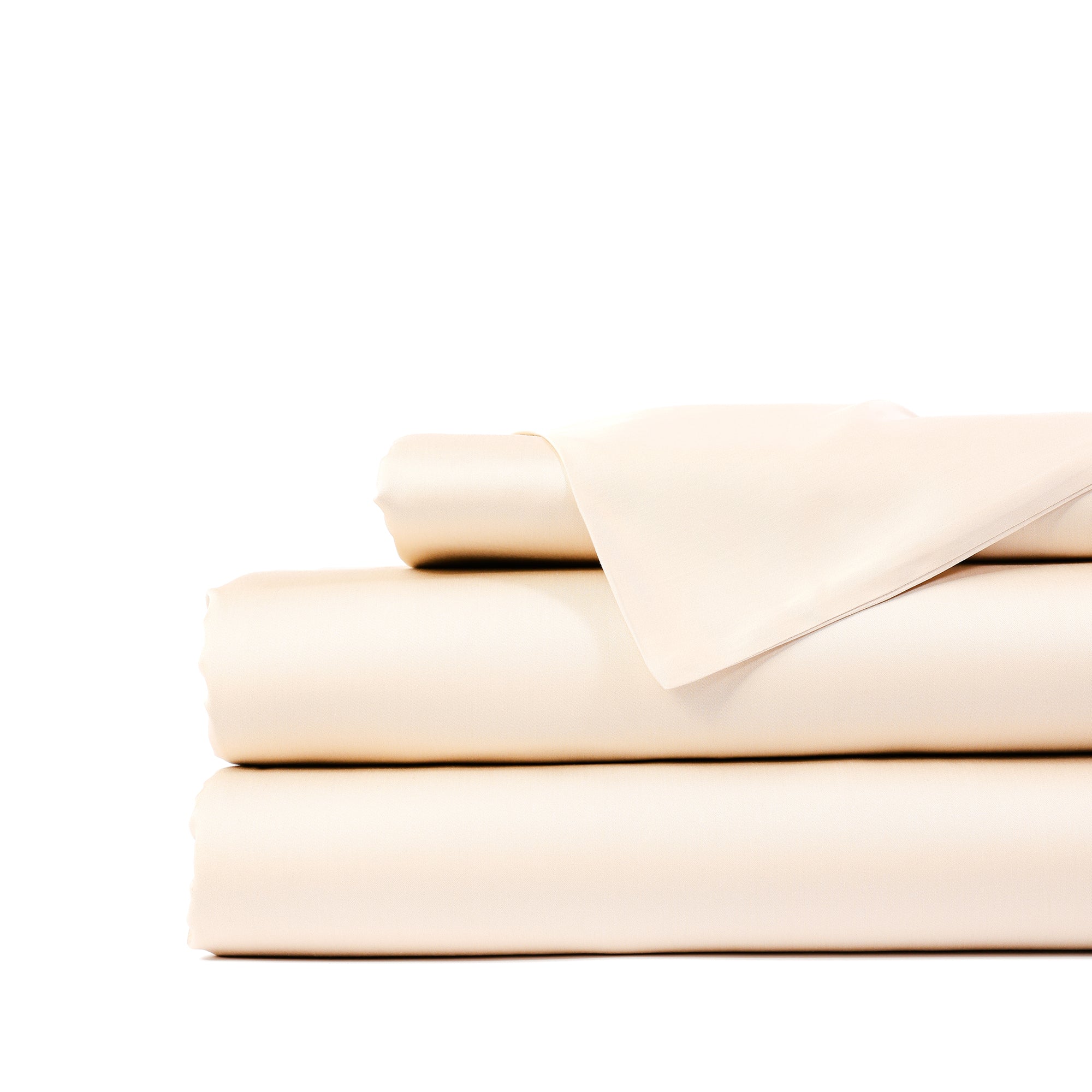 A neatly folded set of Cozy Earth's cream-colored Bamboo Sheet Set, featuring a fitted sheet, a flat sheet, and a pillowcase stacked on top of one another against a plain white background. 
