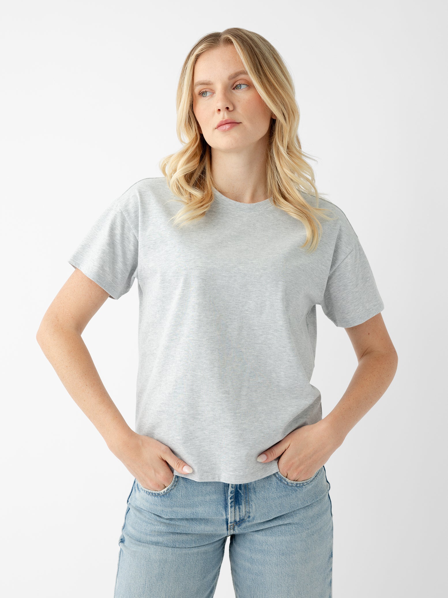 Woman wearing french dove heather tee with white background 