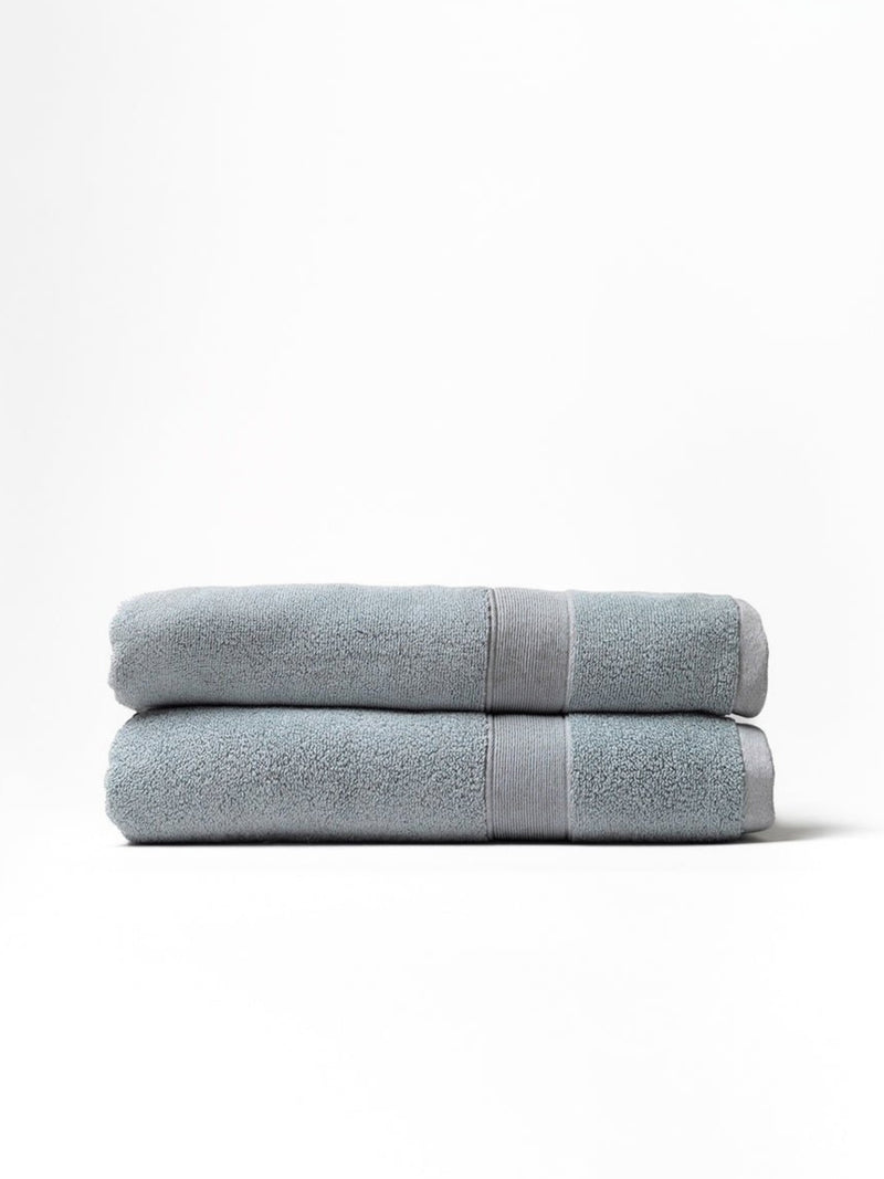 Harbor mist luxe bath towels folded with white background