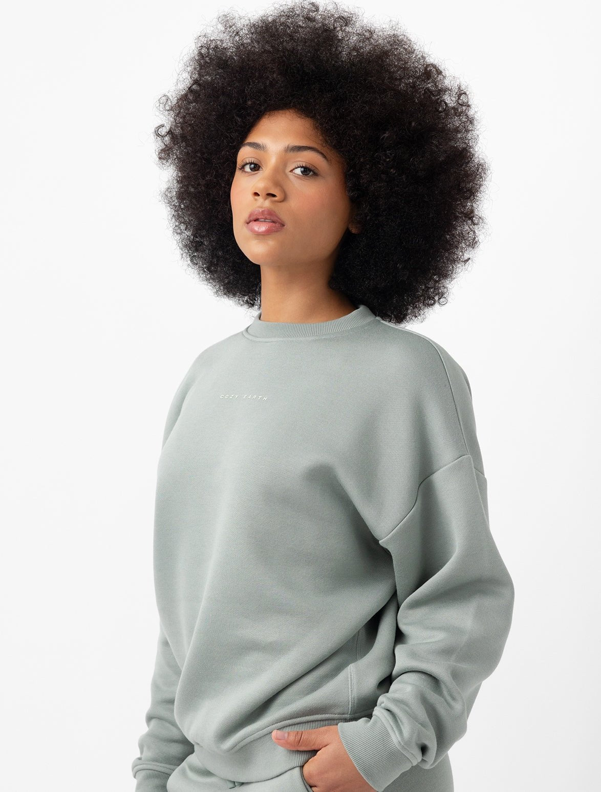 Woman wearing haze cityscape pullover with white background |Color:Haze