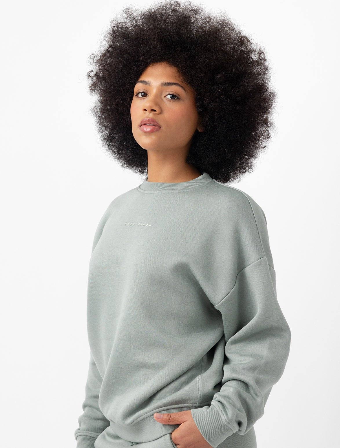 Woman wearing haze cityscape pullover with white background 