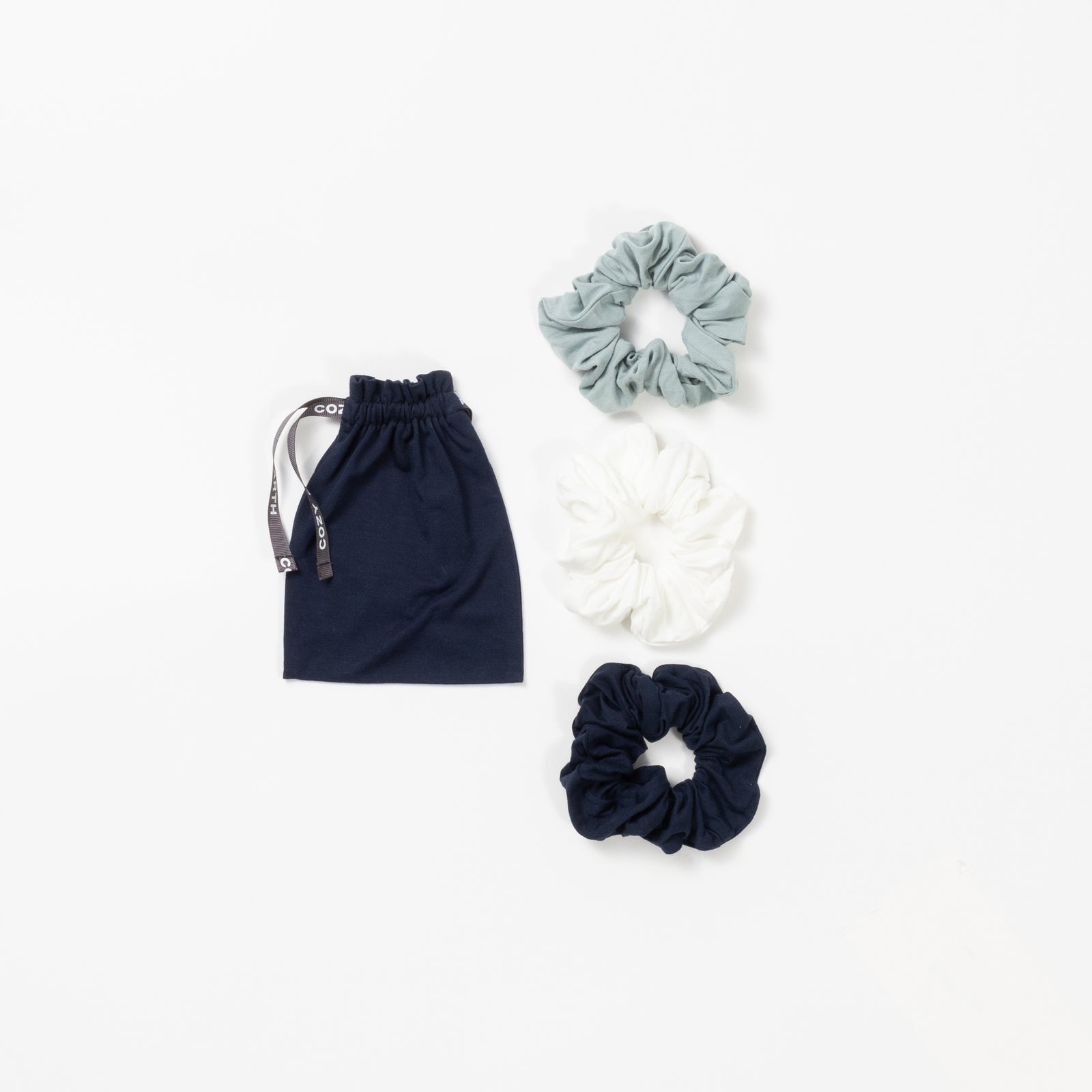 Three pack of scrunchies with brook, ivory, and navy options 