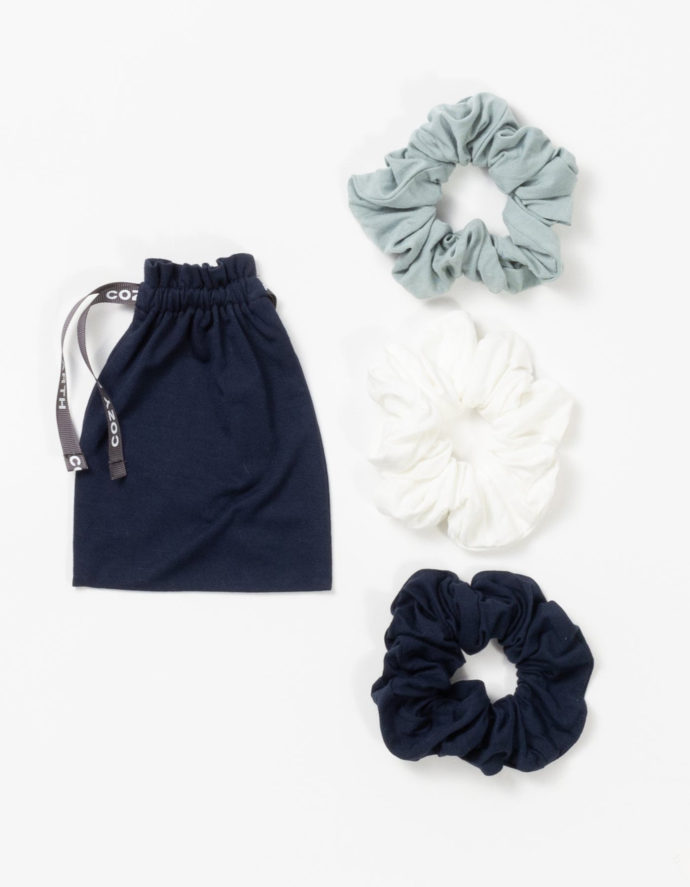 Three pack of scrunchies with brook, ivory, and navy options 