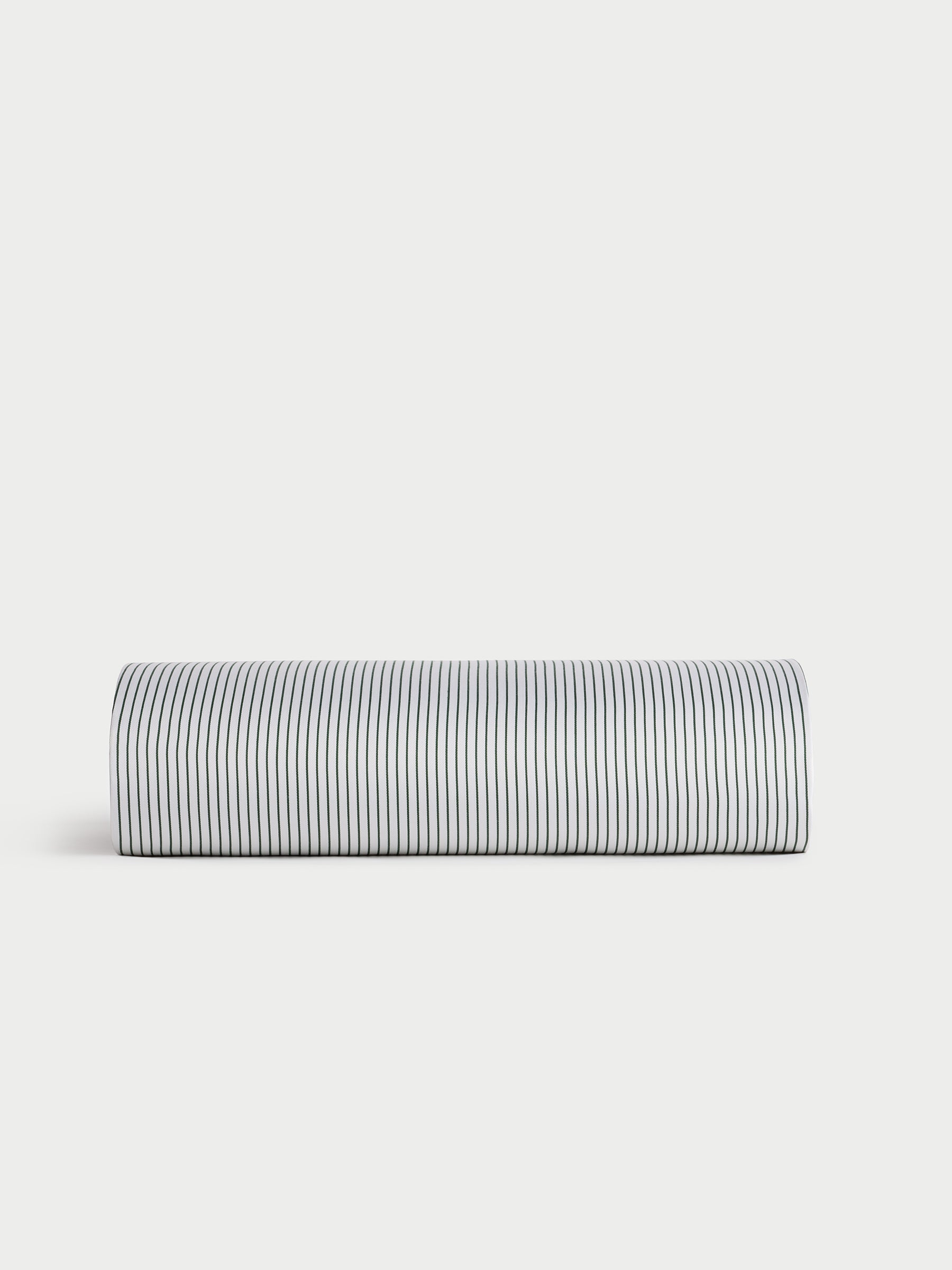 A bamboo flat sheet from Cozy Earth with black and white vertical stripes on a white background, displayed against a simple light gray backdrop. |Color:Jade Pinstripe