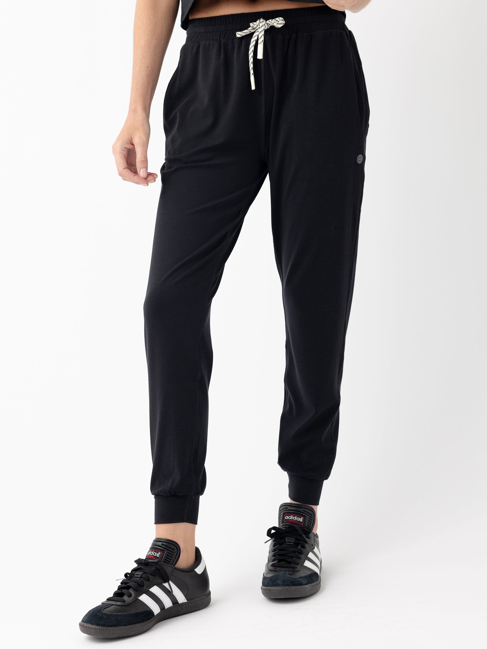 Jet Black Studio Jogger. The Studio Joggers are worn by a woman photographed with a white background. |Color:Jet Black