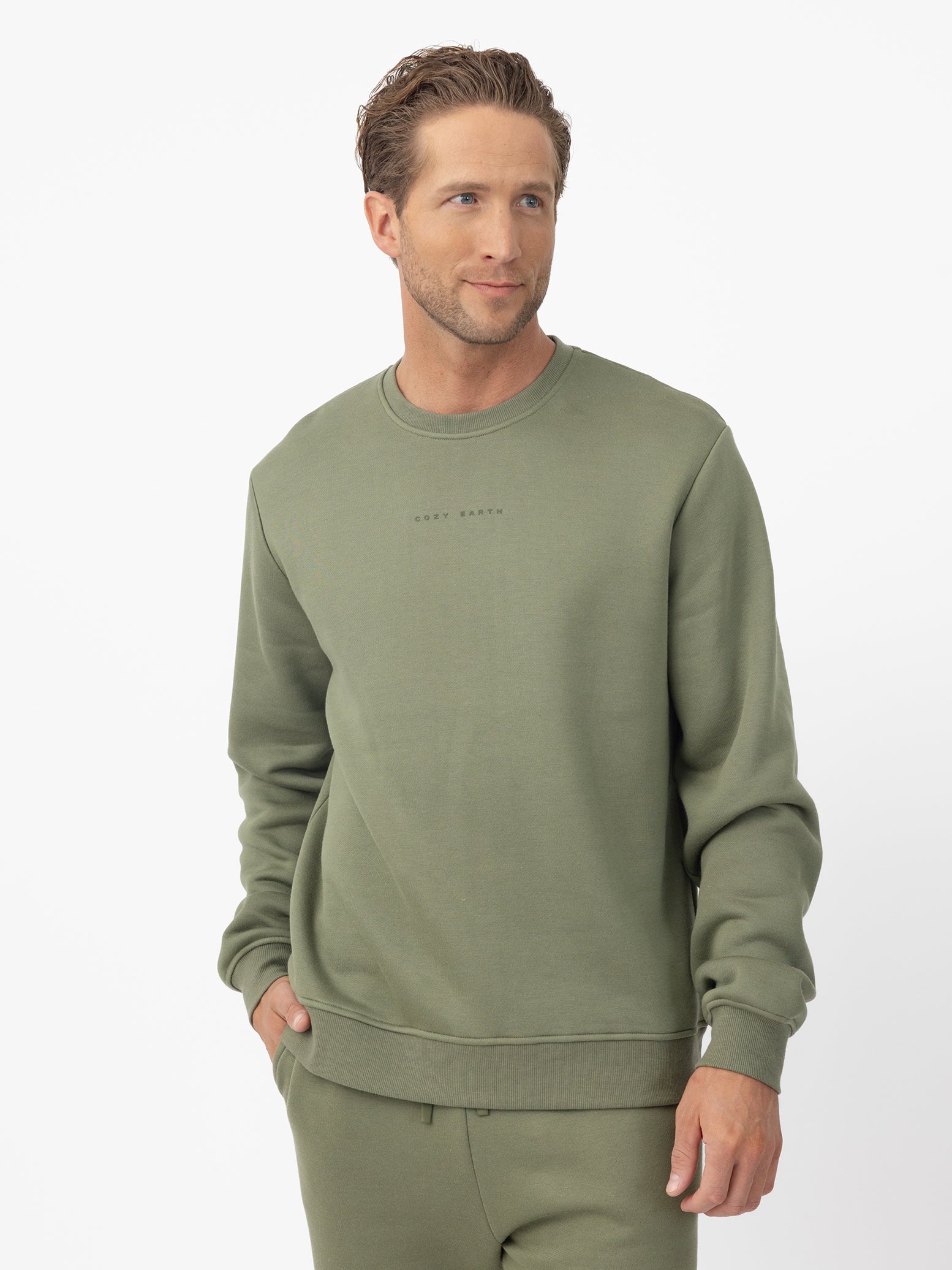 Man wearing Juniper cityscape crewneck with white background 