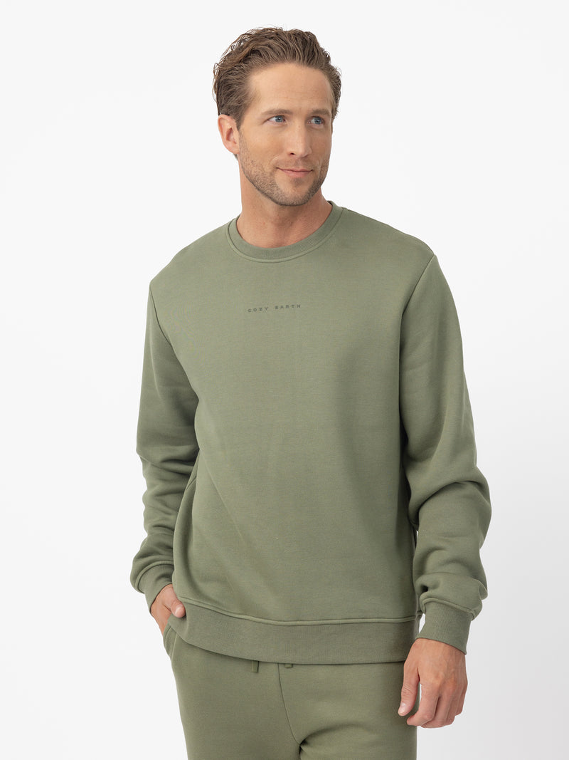 Man wearing Juniper cityscape crewneck with white background
