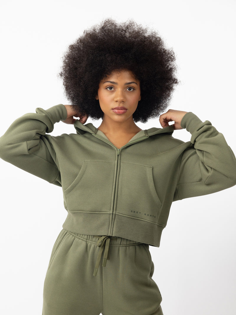 Woman wearing Juniper CityScape Cropped Full Zip with white background