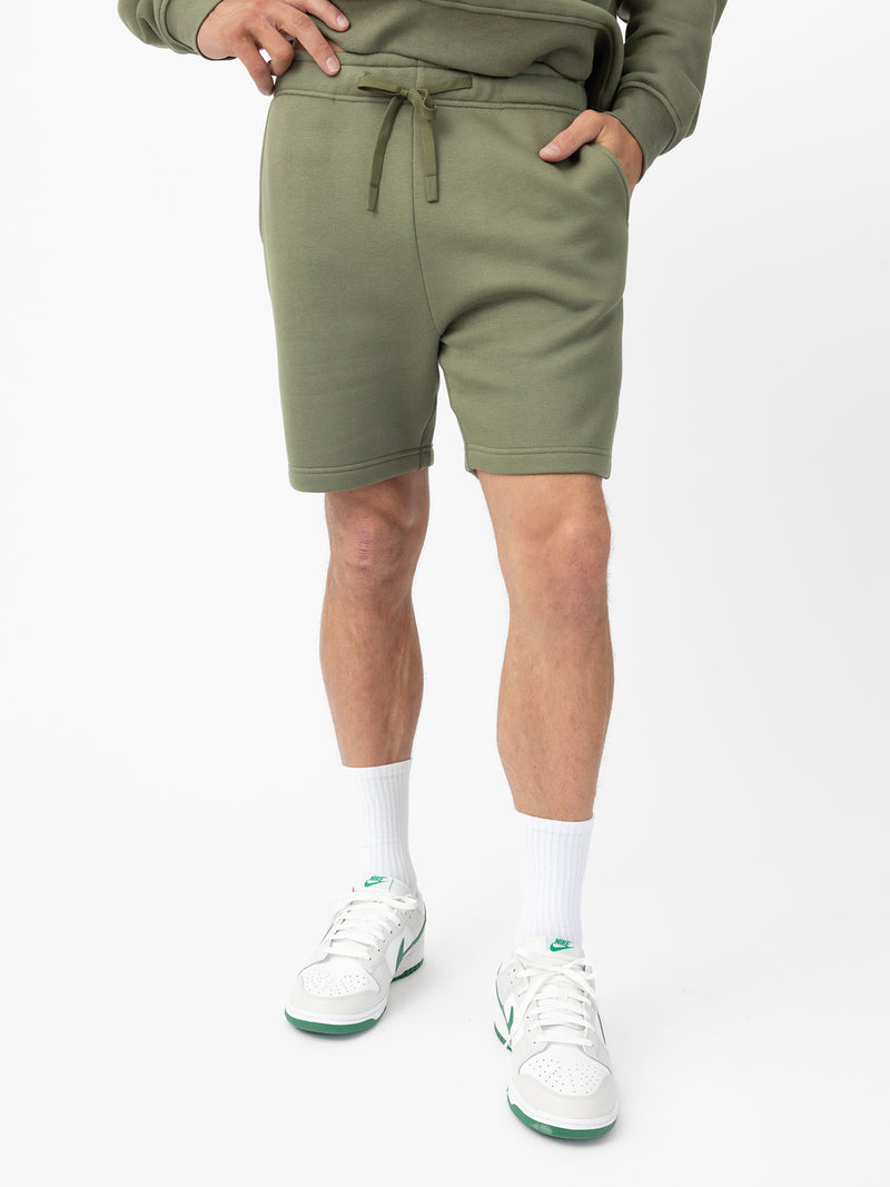 Man wearing Juniper CityScape Shorts with white background