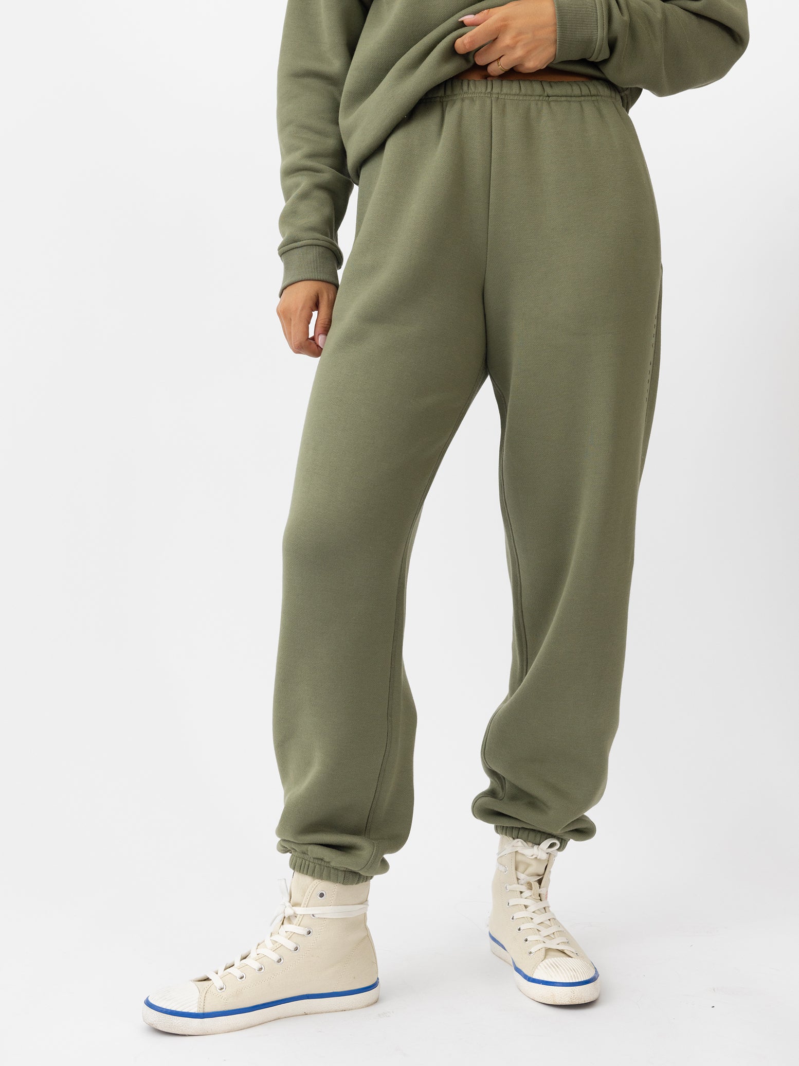 Woman wearing juniper cityscape sweats with white background 