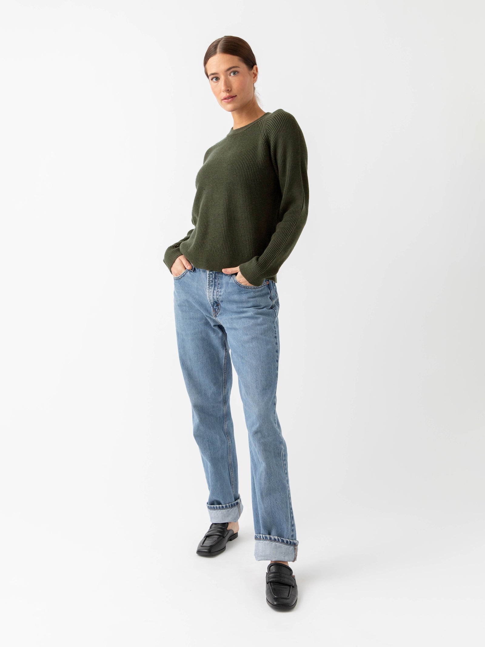 Woman wearing juniper classic crewneck and jeans with white background 