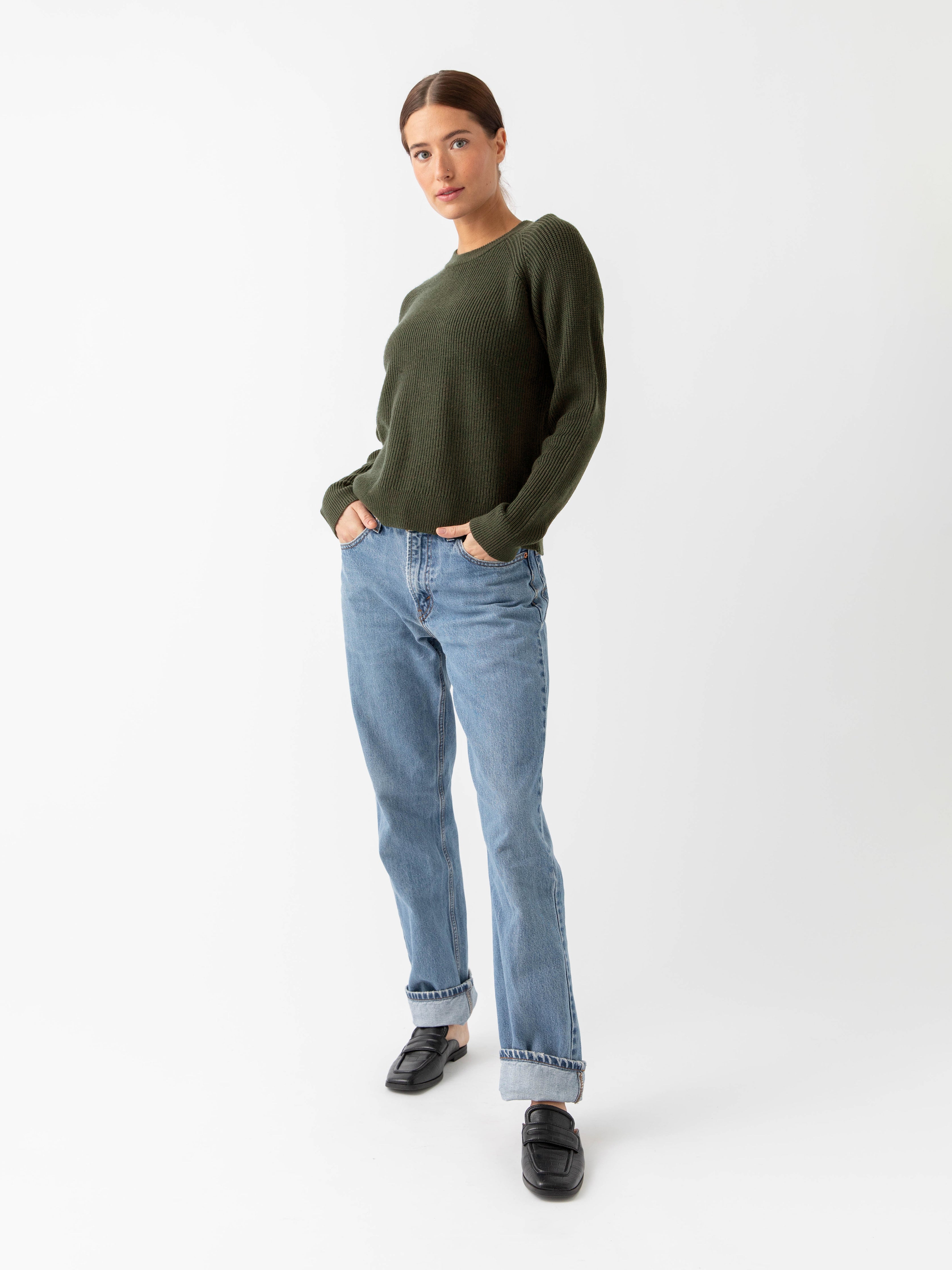 Woman wearing juniper classic crewneck and jeans with white background |Color:Juniper