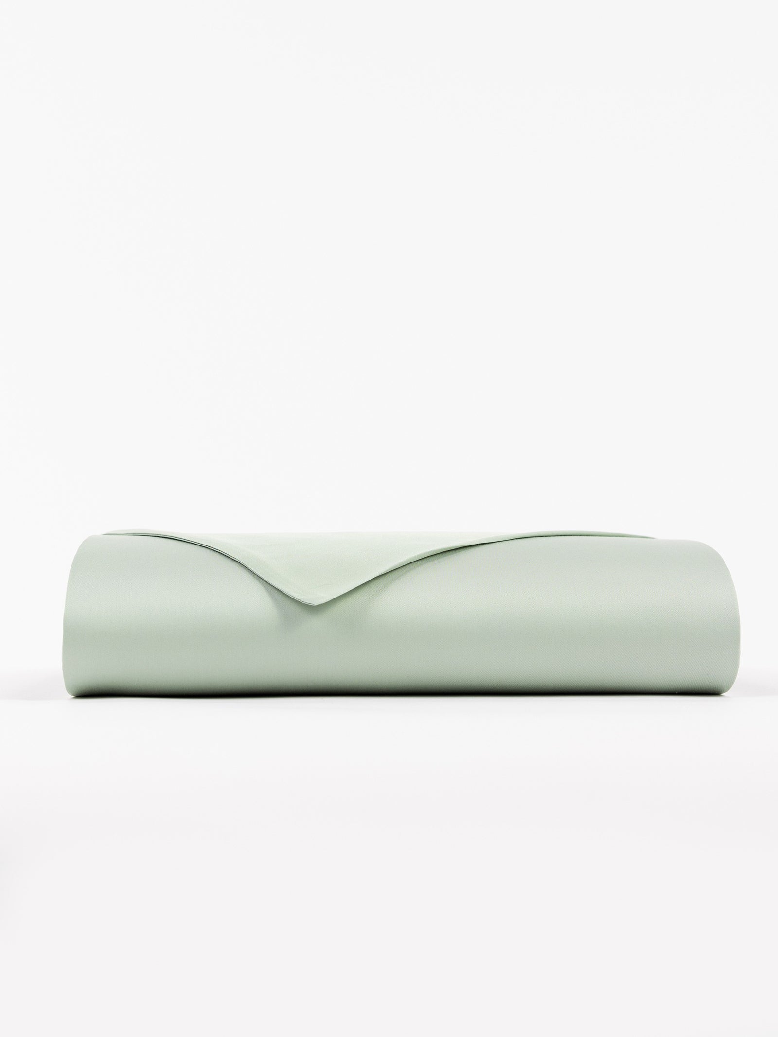 A neatly folded, Cozy Earth Bamboo Flat Sheet in soft light green set against a plain white background. 