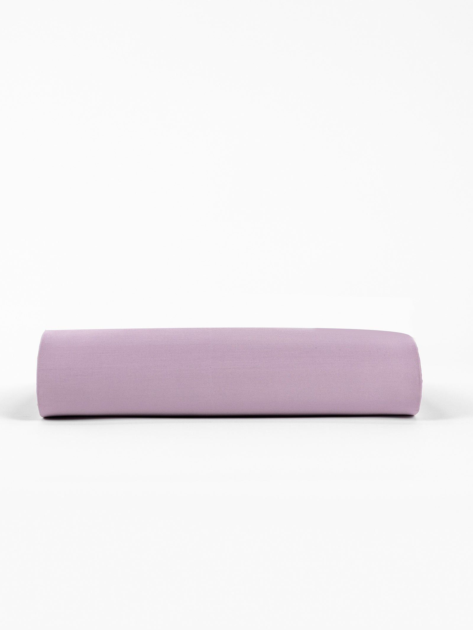 A Bamboo Fitted Sheet by Cozy Earth in soft, light purple, lying flat against a plain white background. 