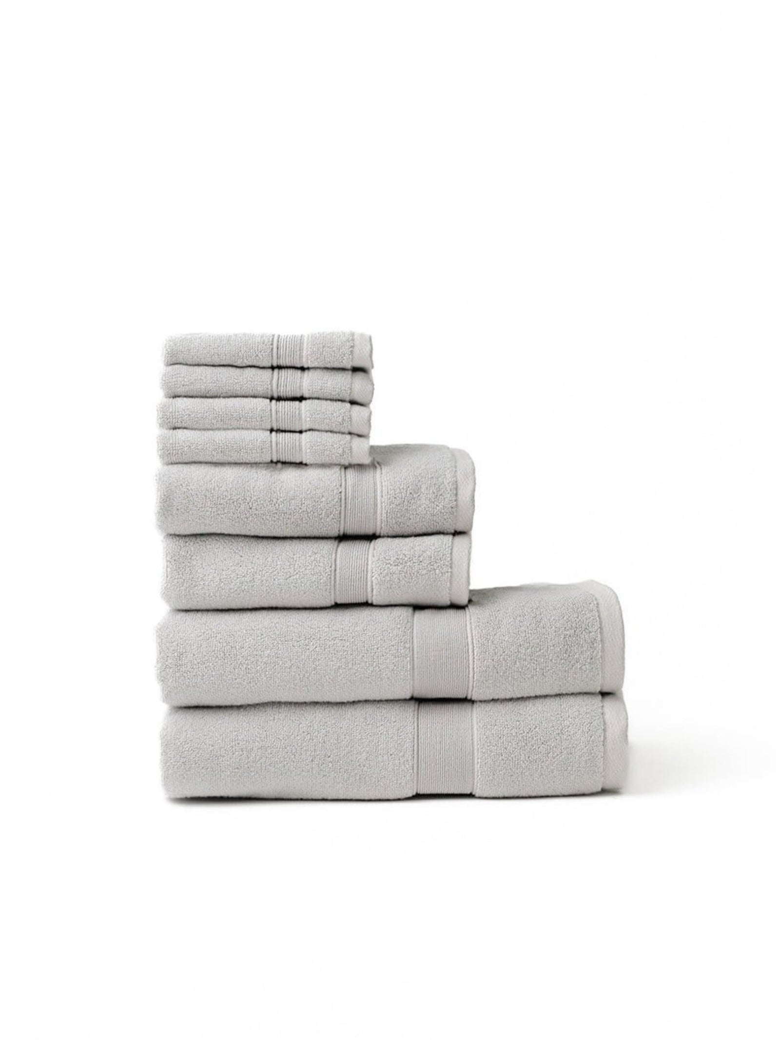 Light grey luxe bath towel set folded with white background 