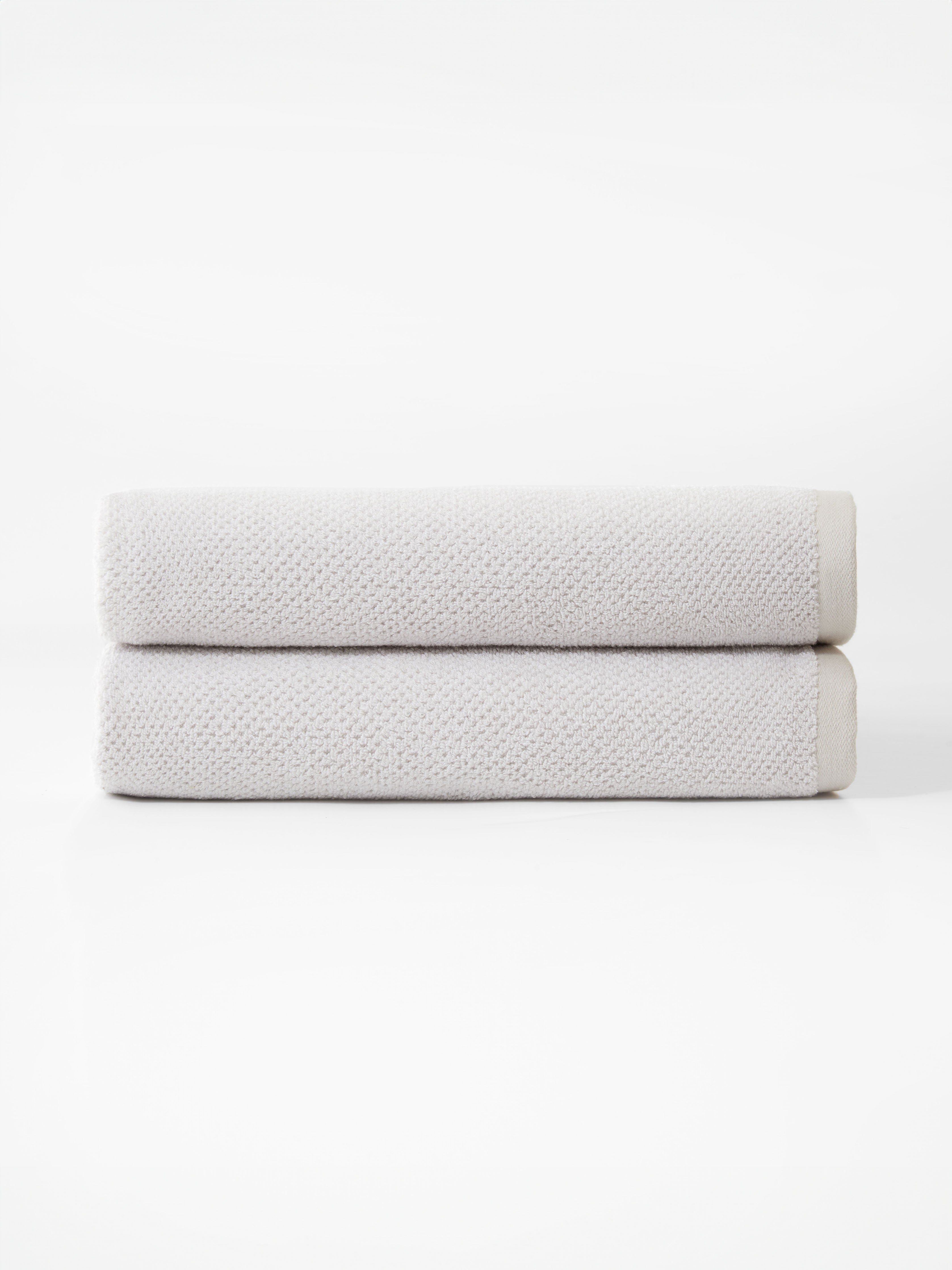 Nantucket Bath Towels in the color Heathered Light Grey. Photo of Nantucket Bath Towels taken with the bath towels on a white background. |Color: Heathered Light Grey