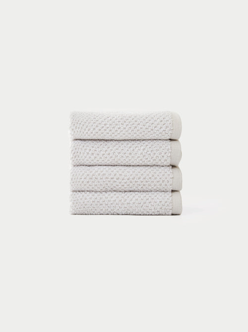 Nantucket Wash Cloths in the color Heathered Light Grey. The Wash Cloths are neatly folded. The photo of the wash cloths was taken with a white background.|Color:Heathered Light Grey