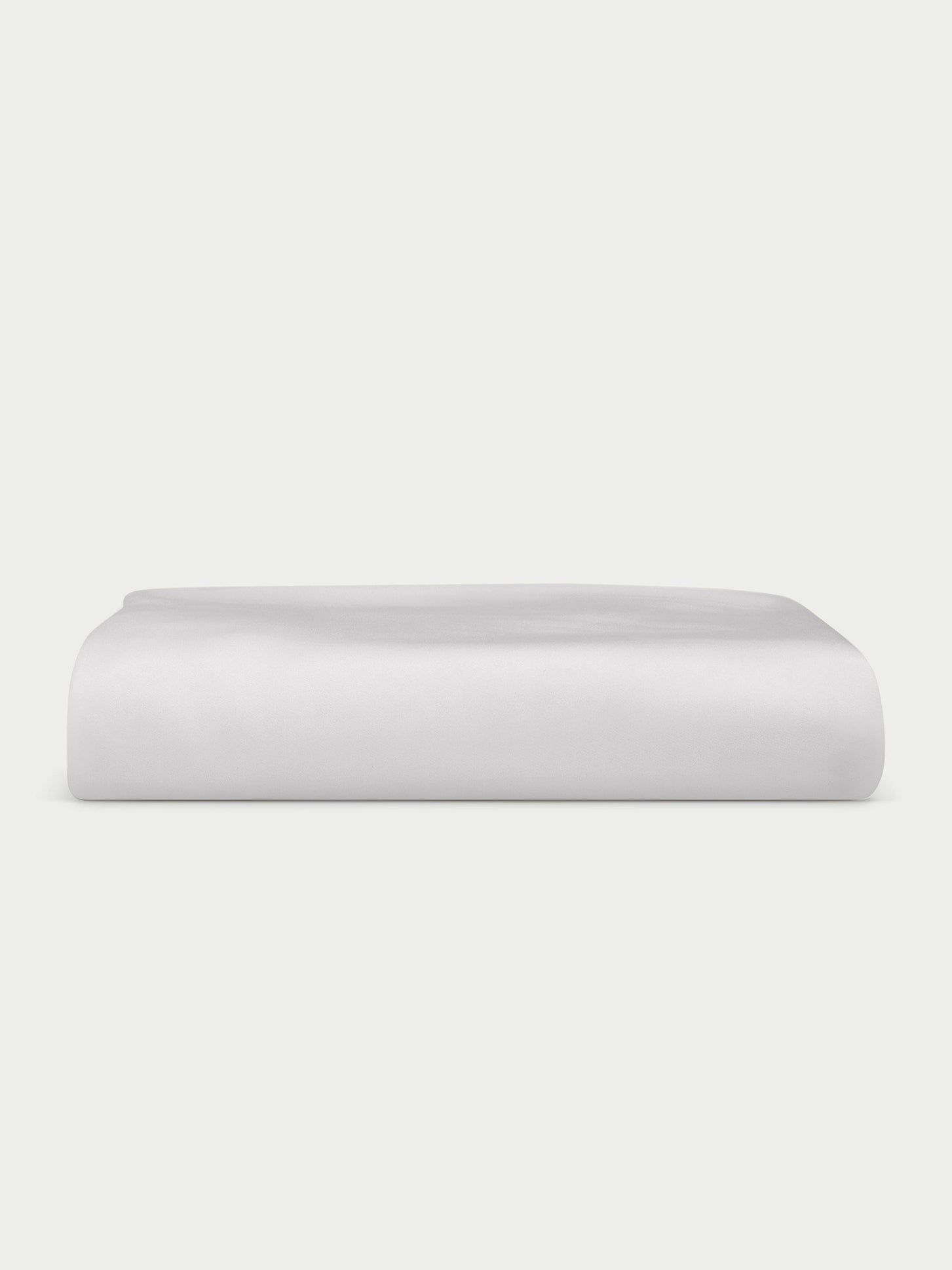 Light grey fitted sheet folded with white background 