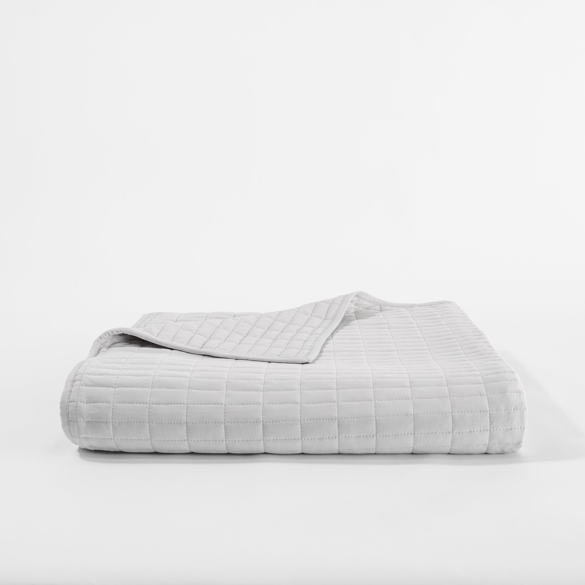 Light grey folded bamboo jersey quilt with white background |Color:Light Grey