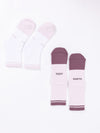 Two pairs of the Essential Quarter Sock 2-Pack from Cozy Earth are displayed on a white background. One pair is predominantly white with "COZY" and "EARTH" written in light grey, while the other pair features a combination of purple and white with "COZY" and "EARTH" written in dark grey. |Color:Lilac