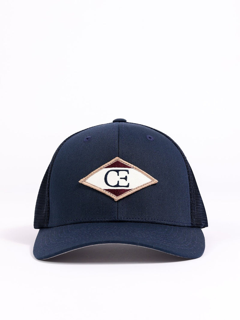 Studio shot of navy diamond mesh trucker hat